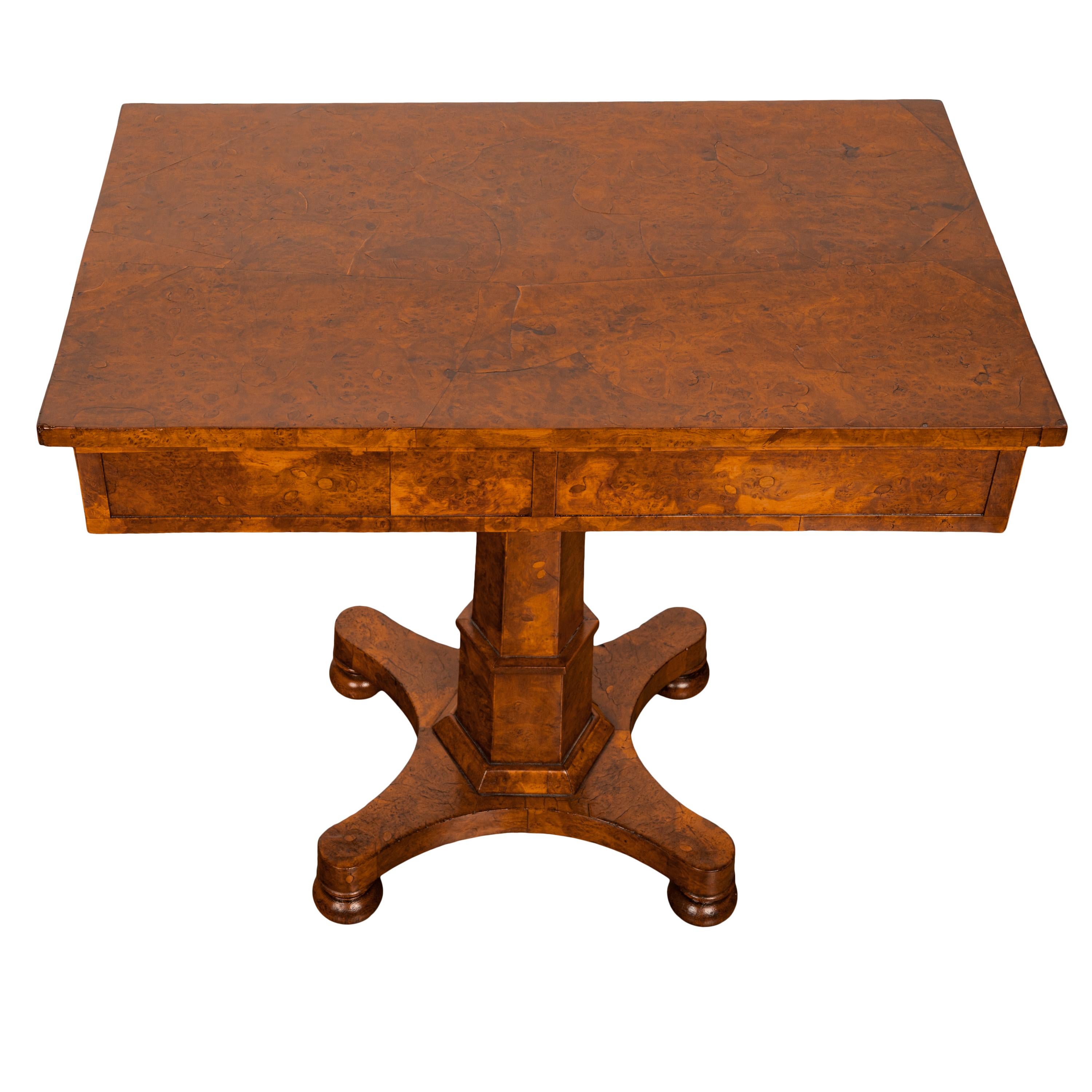 A very rare antique George IV late Regency burl elm pedestal side table, circa 1825.
The table made from the most incredible burl elm throughout, the highly figured grain rectangular table top with a drawer at each end and both drawers having a pair