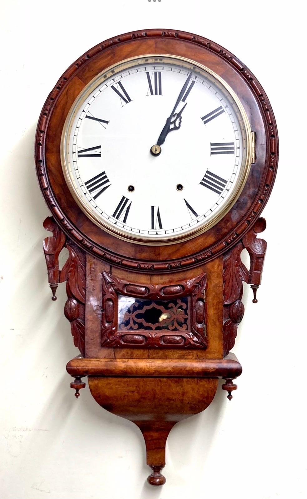 Beautifully shaped and rare antique burr walnut drop dial wall clock
Striking hourly on bell.
{8day}
This is a superb antique walnut drop dial wall clock with beautiful case with scroll design bottom, original 8 day twin train striking movement