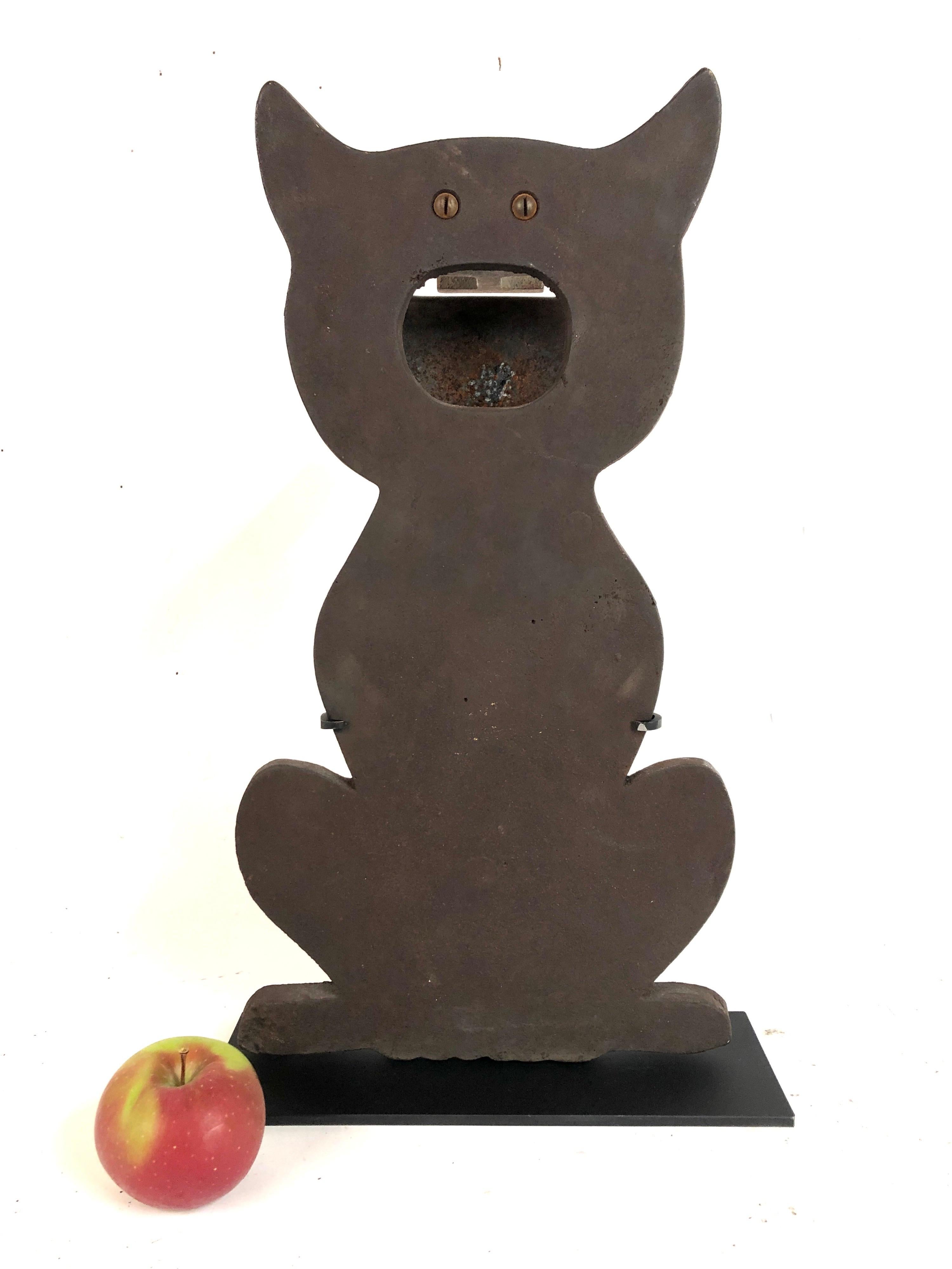 A rare large antique cast iron cat shooting gallery target with original strike plate. Only the wire holding up the 