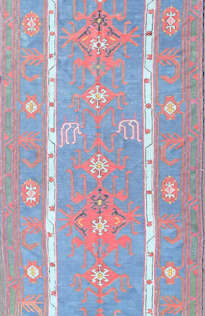 Rare antique Caucasian Avar flat-weave Gallery rug in Vibrant blue tones. 

Measures:4'8 x 13'9

Featuring an all-over geometric medallion design with complementary geometric motifs throughout, this unique, 1900s Kilim rug showcases an array of