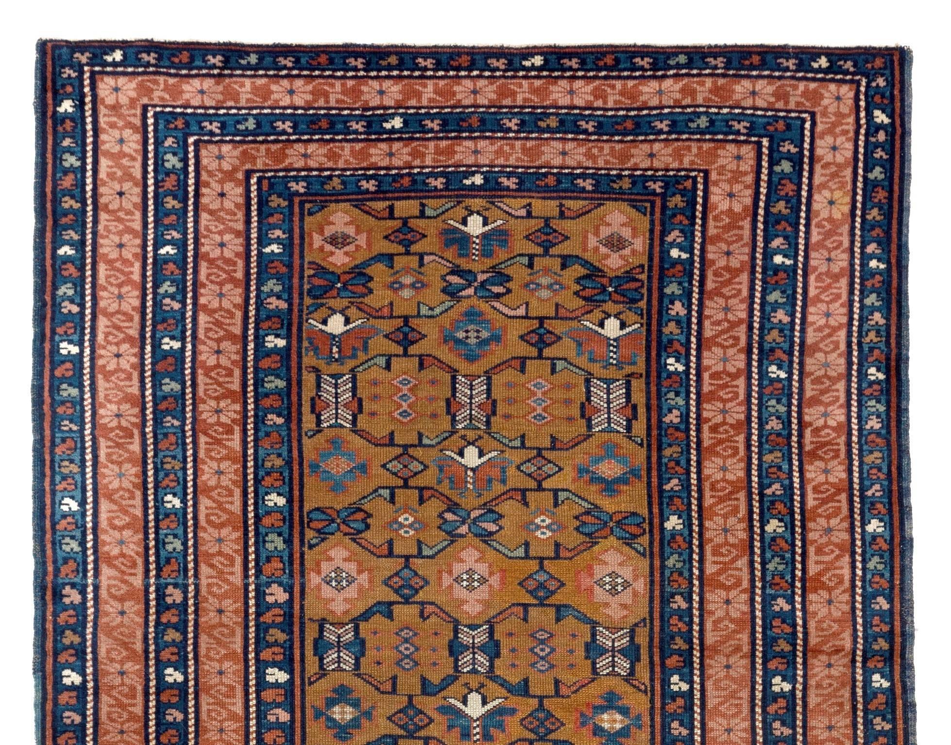 Antique Caucasian Seichur rug with dark yellow ground and rare triple border.
Finely hand-knotted with even medium wool pile on wool foundation. Very good condition. Sturdy and as clean as a brand new rug (deep washed professionally).