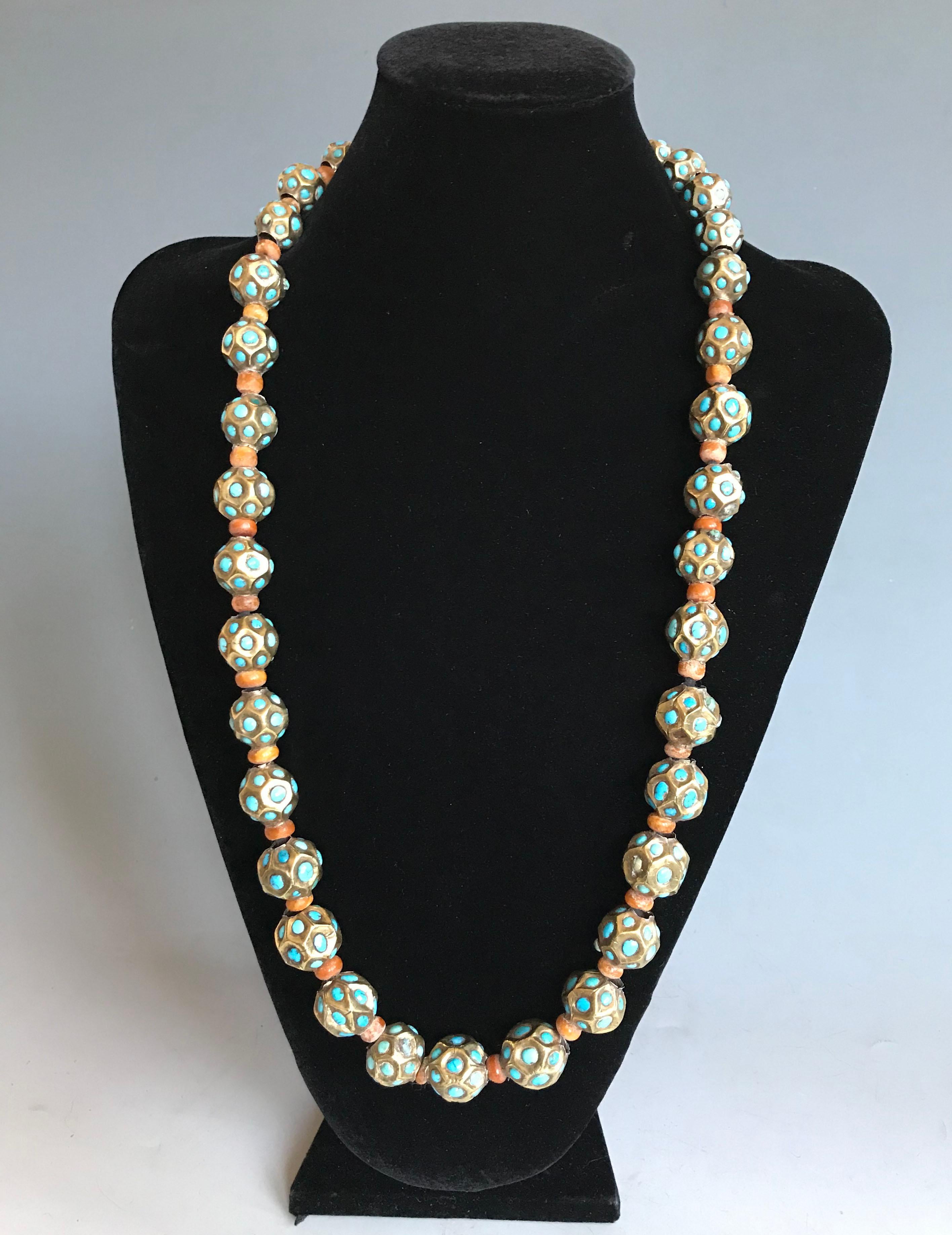 A wonderful very rare Central Asian necklace of multi faceted silver and gold gilt beads with small turquoise pieces in each faceted section, beautiful antique beads dating from 17/18 Century AD and earlier. The necklace is slightly graduated with