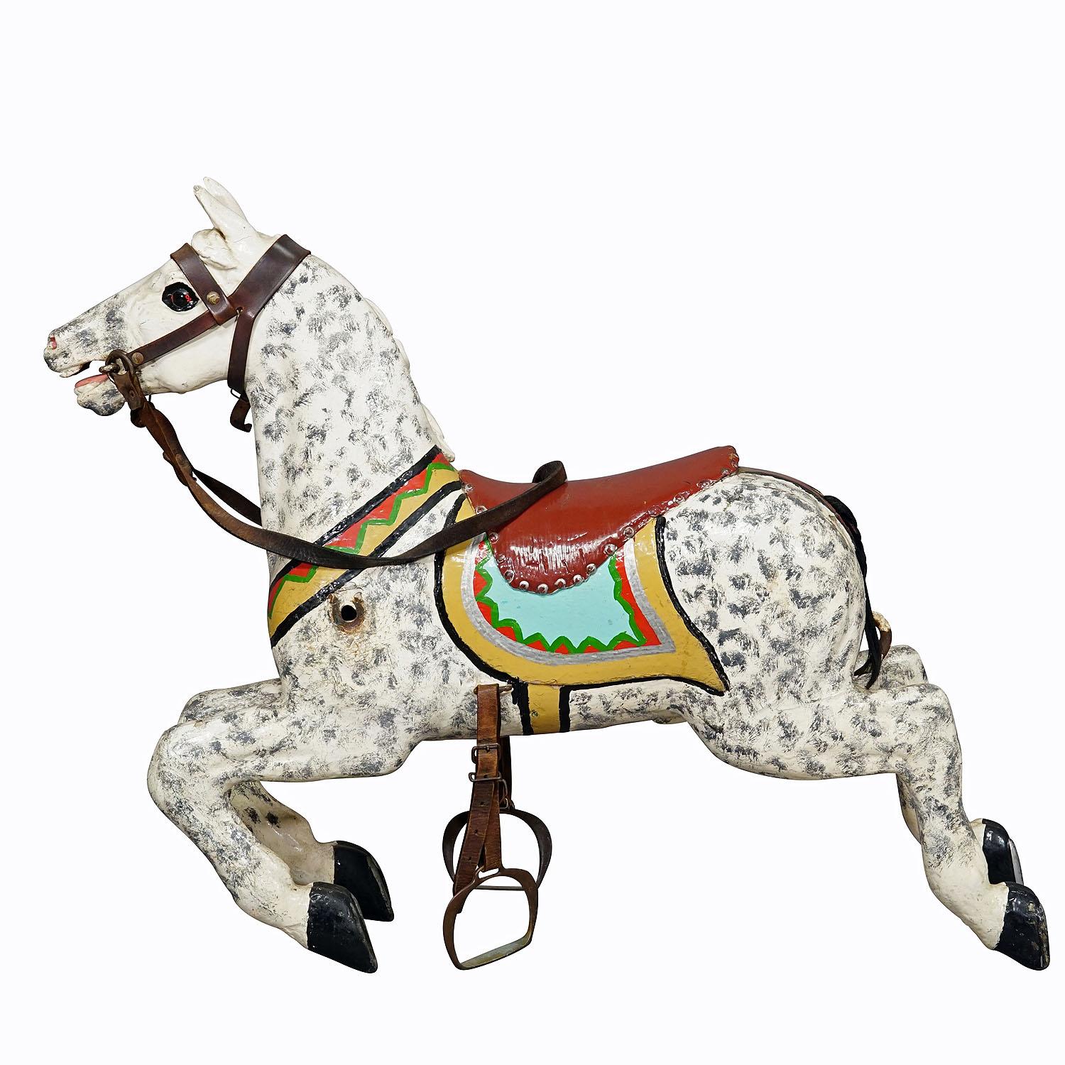 Rare Antique Children Carousel Horse, Germany early 20th Century

A wooden carved children's carousel, stallion with polychrome painting, made in Germany around 1910. Original unrestored condition, partially repainted, traces of use according to the
