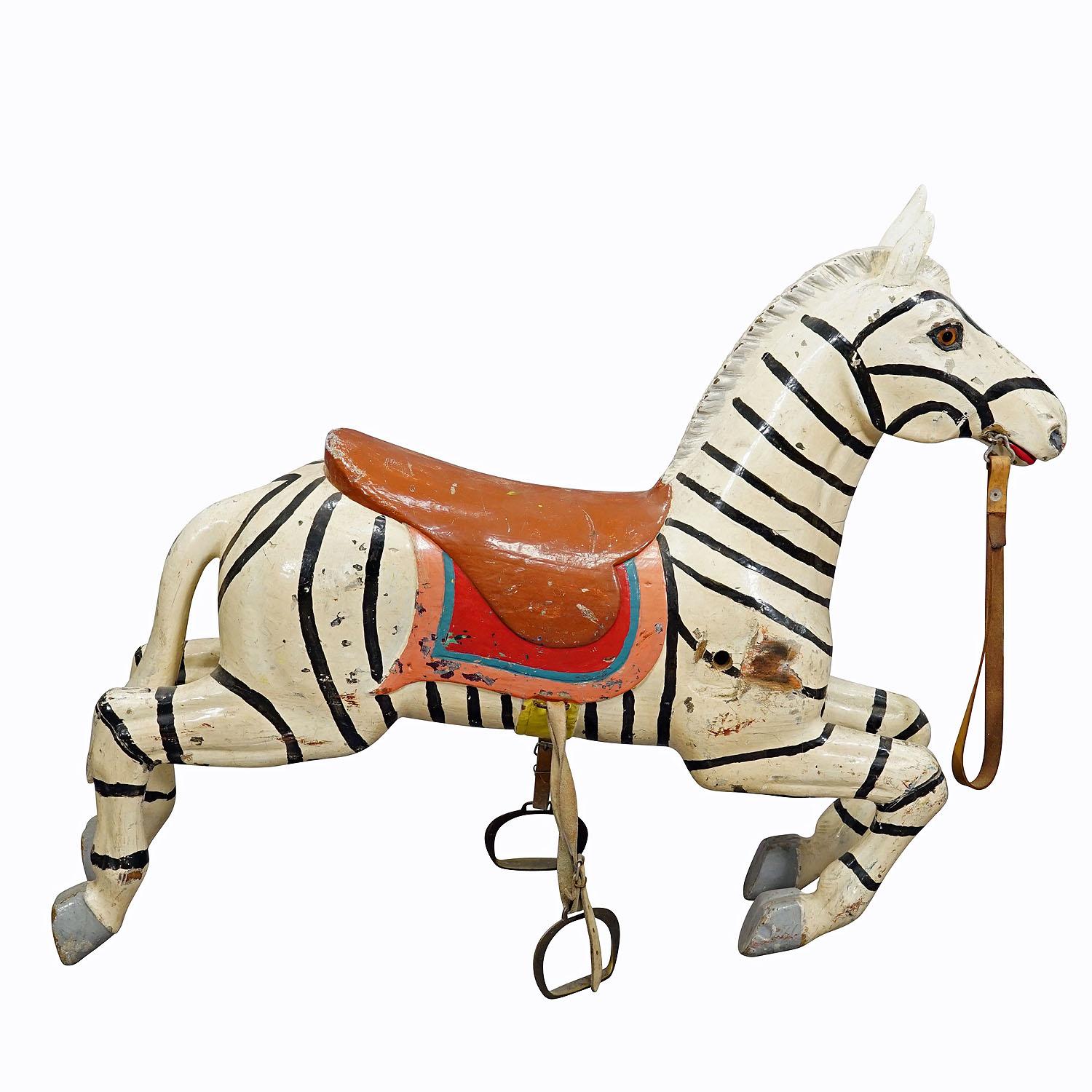 Rare Antique Children Carousel Zebra, Germany 1920s
Item e7300
A wooden carved children's carousel zebra with multicolored painting, made in Germany around 1910. Unrestored original condition, partially painted over, signs of use due to age, cut on