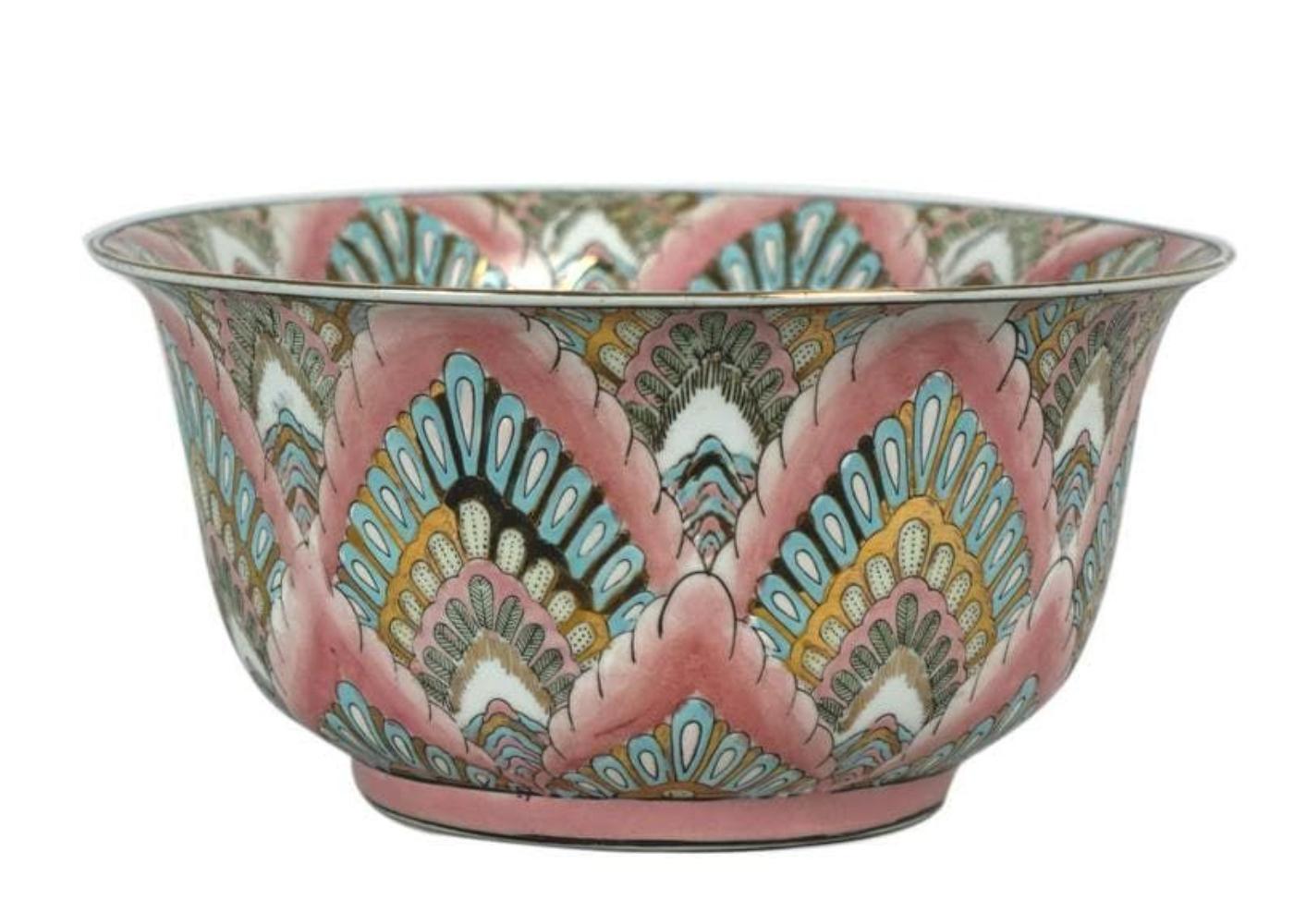 Very unusual Chinese export porcelain bowl. It has bright colors with a lot of gold throughout. Height: 5 in, Width: 10 in, Base Width: 5.25 in