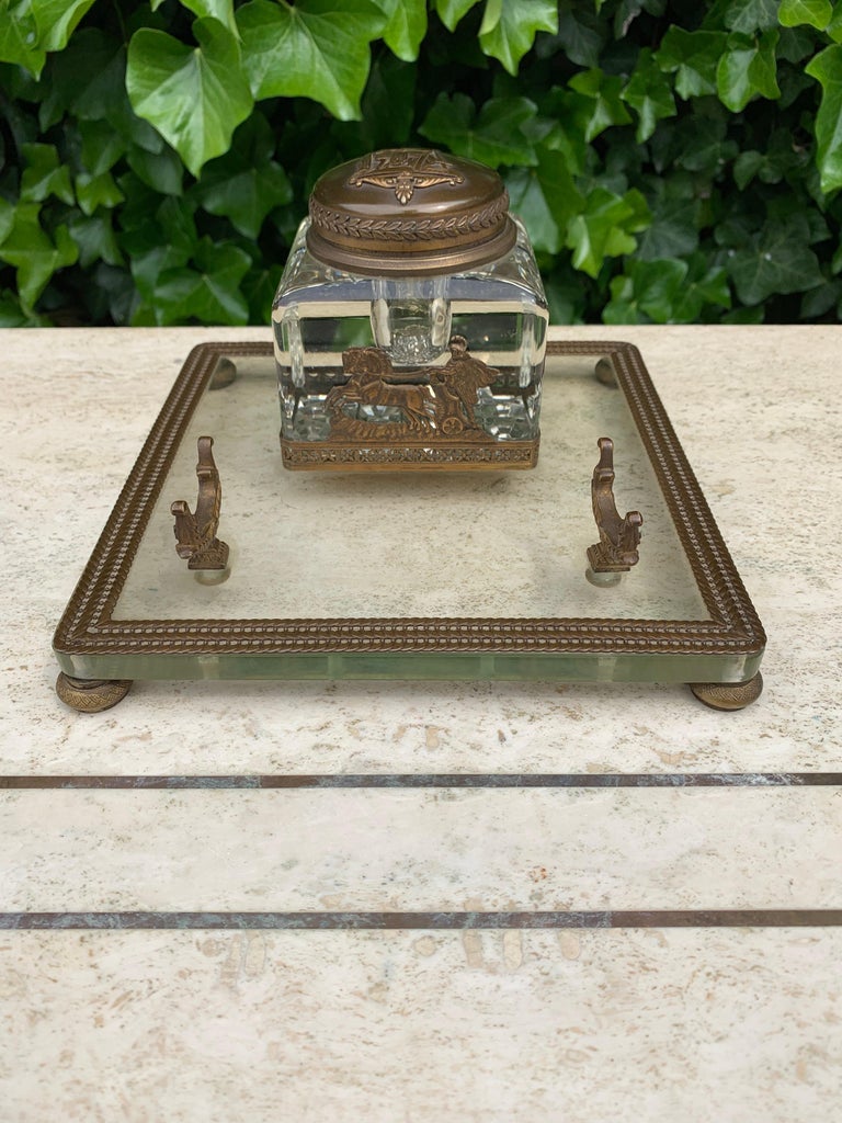Stylish, rare and mint condition bronze, brass and glass desk piece.

This completely original inkstand dates from the late 19th century and it has a large number of striking Roman emperial style elements. To find such a rare antique in museum
