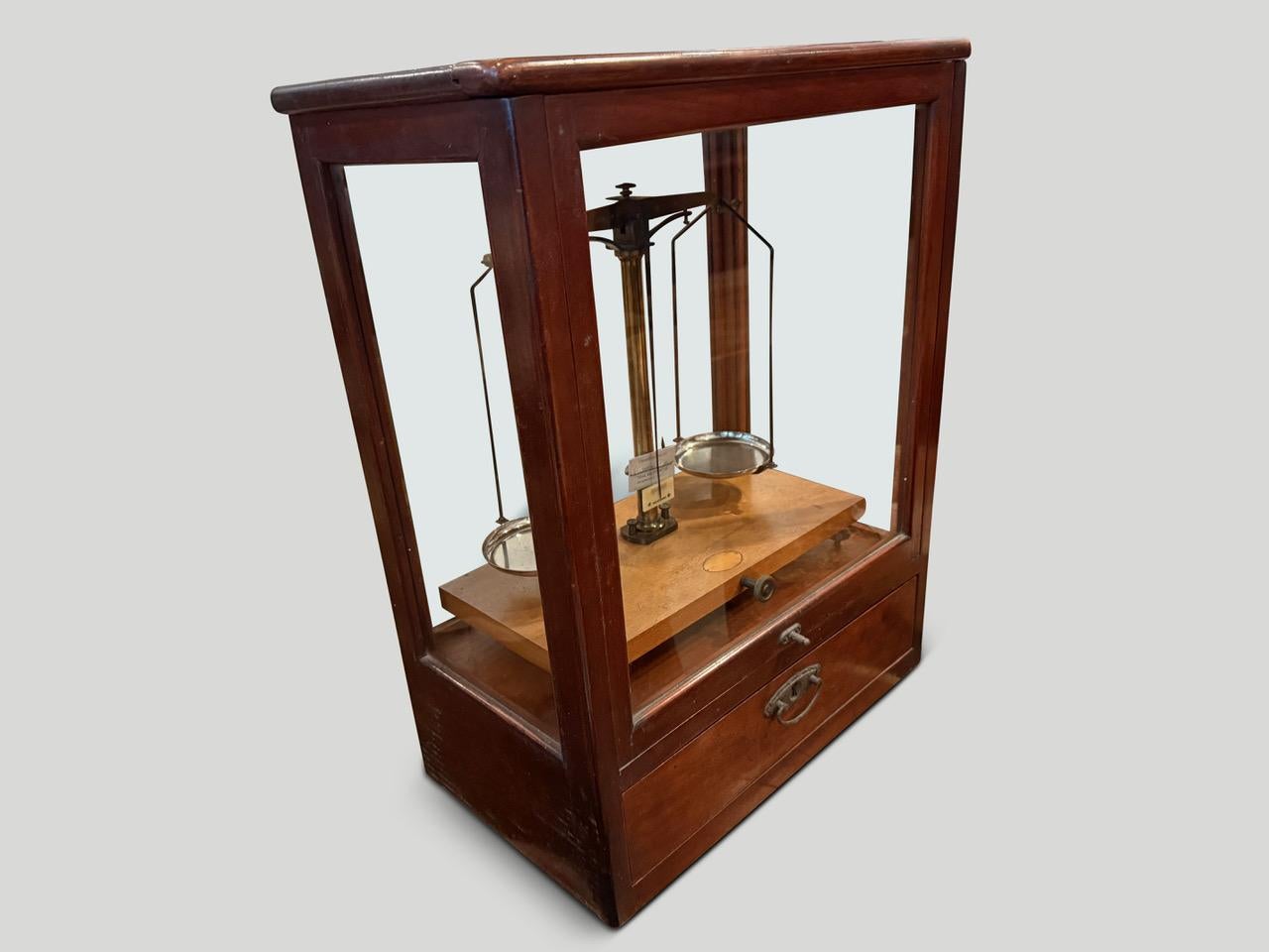Beautiful antique scale originally from Germany. The front glides up for access and the glass and hardware are original. Circa 1940.

Andrianna Shamaris. The Leader In Modern Organic Design. 