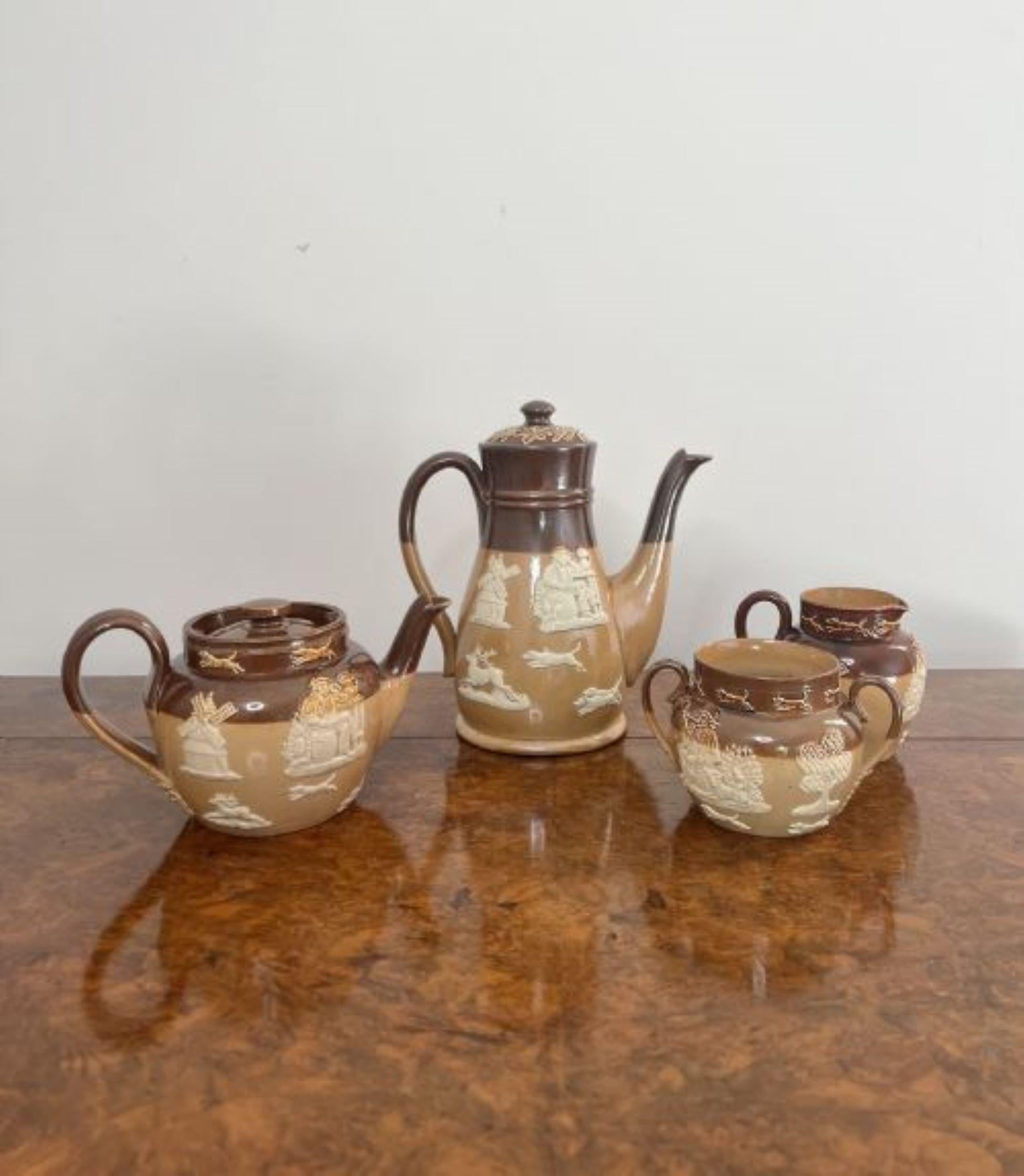 Rare antique Doulton four piece tea set, comprising of a coffee pot, tea pot, milk jug and sugar bowl decorated in hunting scenes in light and dark brown colours.
