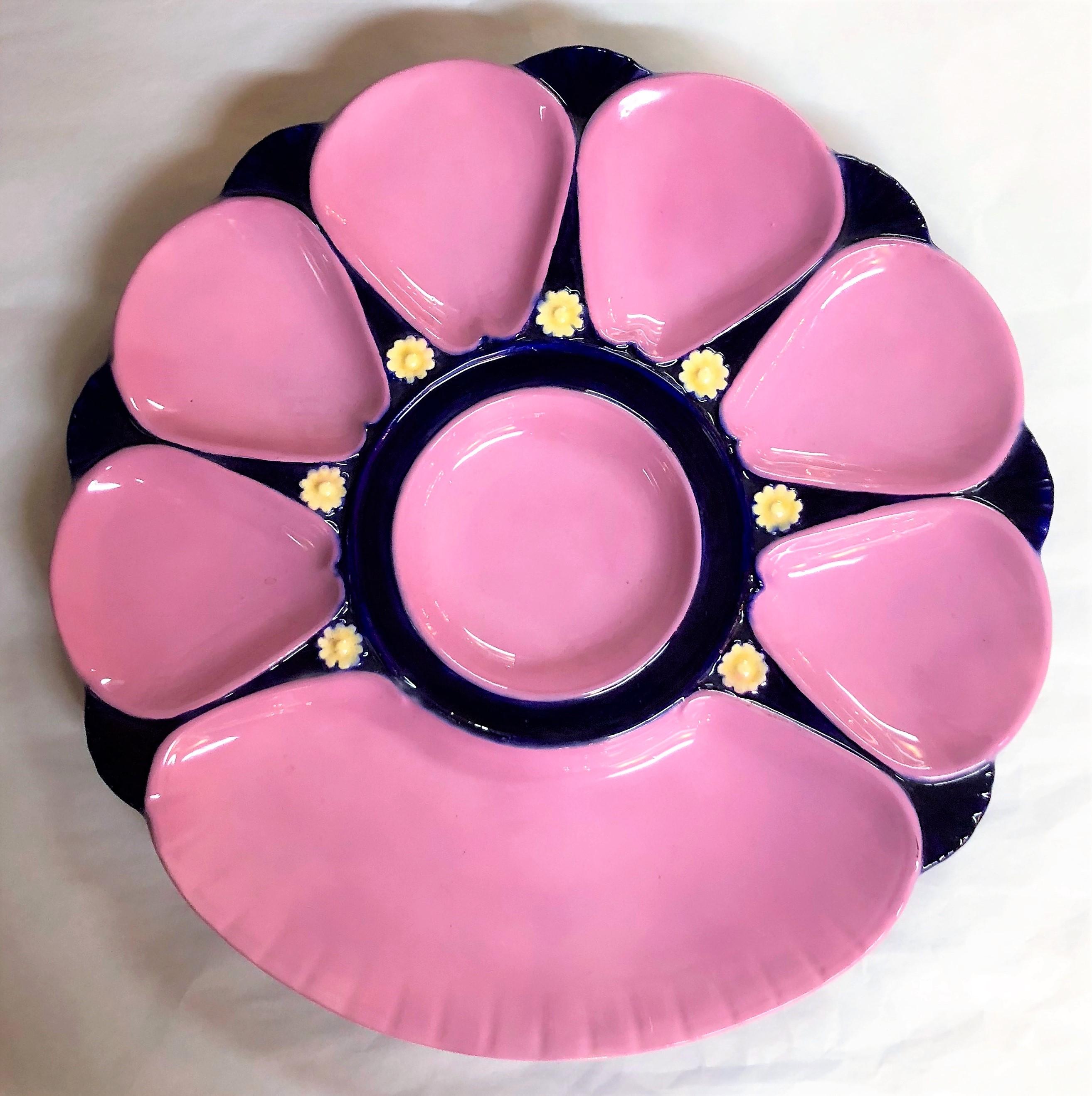 Antique English Minton Majolica oyster plate in a rare pink and blue color with a large cracker-well design, circa 1890.