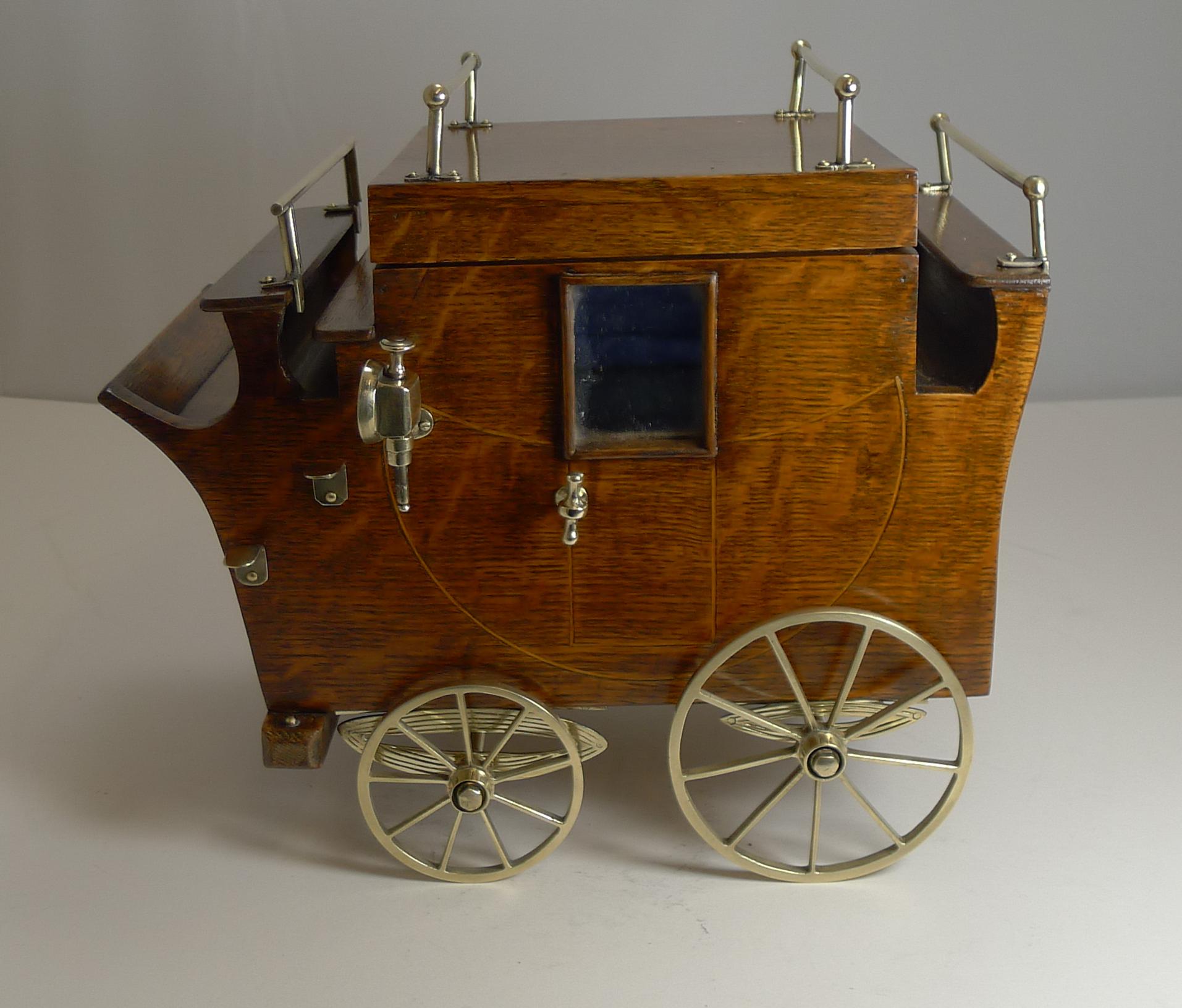 Rarely found or even seen, this novelty Edwardian cigar box is beautifully executed in solid oak in the form of a horse drawn carriage.

The sides are inlaid to emulate the panelling and door, the window made from the original mirrored glass. To