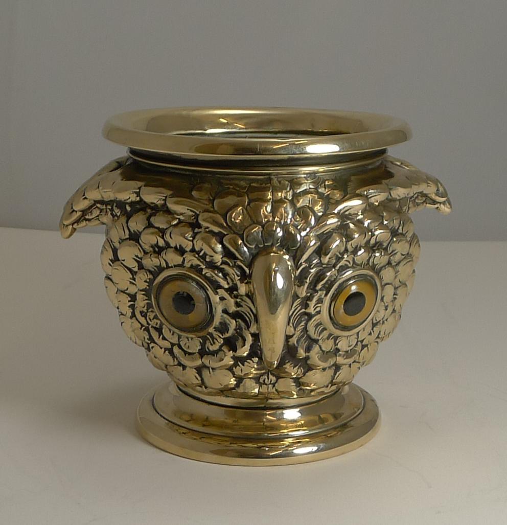 These Victorian figural / novelty Jardiniere come along so very rarely and are always highly sought-after.

Cast from solid English brass cast in the form of an Owl's head both back and front, both sides retaining their original glass