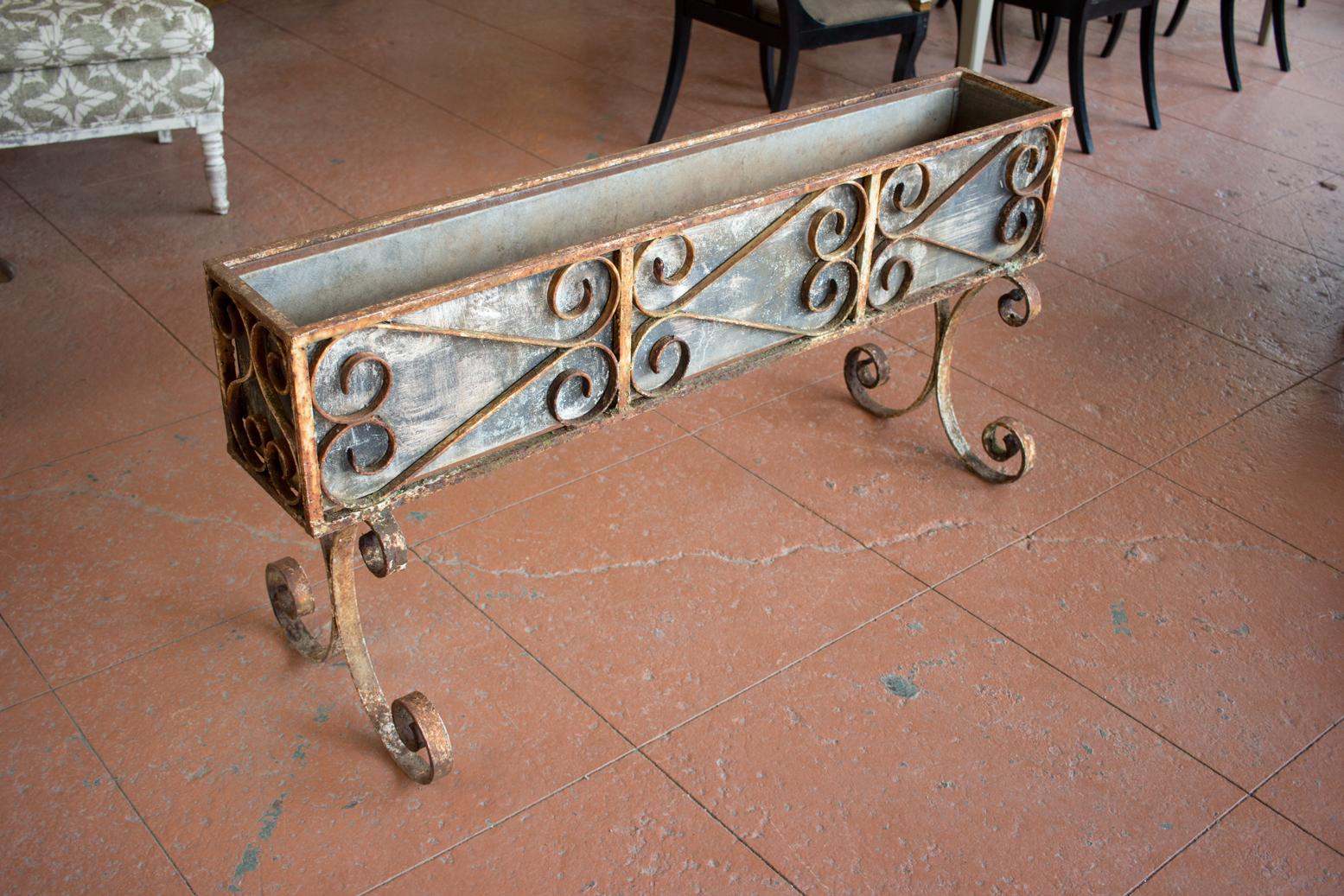 This is a rare Art Nouveau substantial English wrought iron conservatory plant box with its original zinc lined trough. Everything about this piece is gorgeous including the patina.