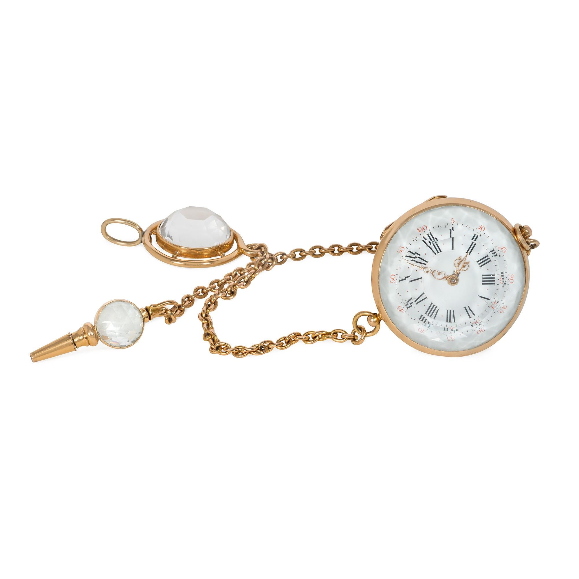 An unusual antique gold and rock crystal chatelaine watch pendant designed as an oversized diamond rendered in carved rock crystal, with Roman numerals and a gold winding key set with a round faceted crystal, suspending from gold chains and gold and