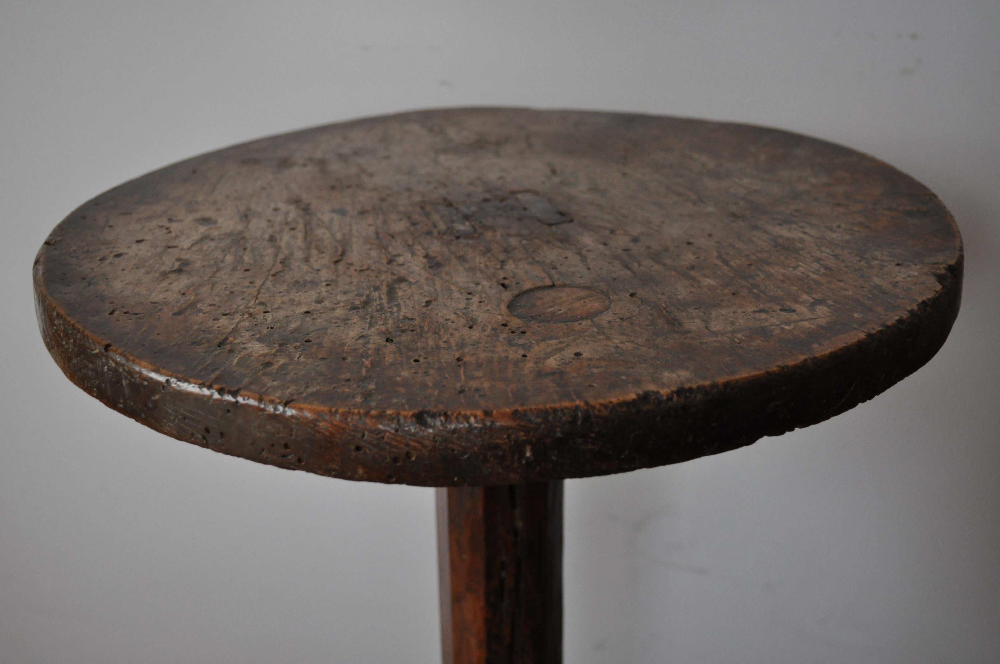 A very rare and unusual haute époque French tripod table, in beautiful untouched condition with superb color and patination. A nice thick beech top with through tenons, chamfered oak column with legs pegged on. The legs are tenoned in on the sides