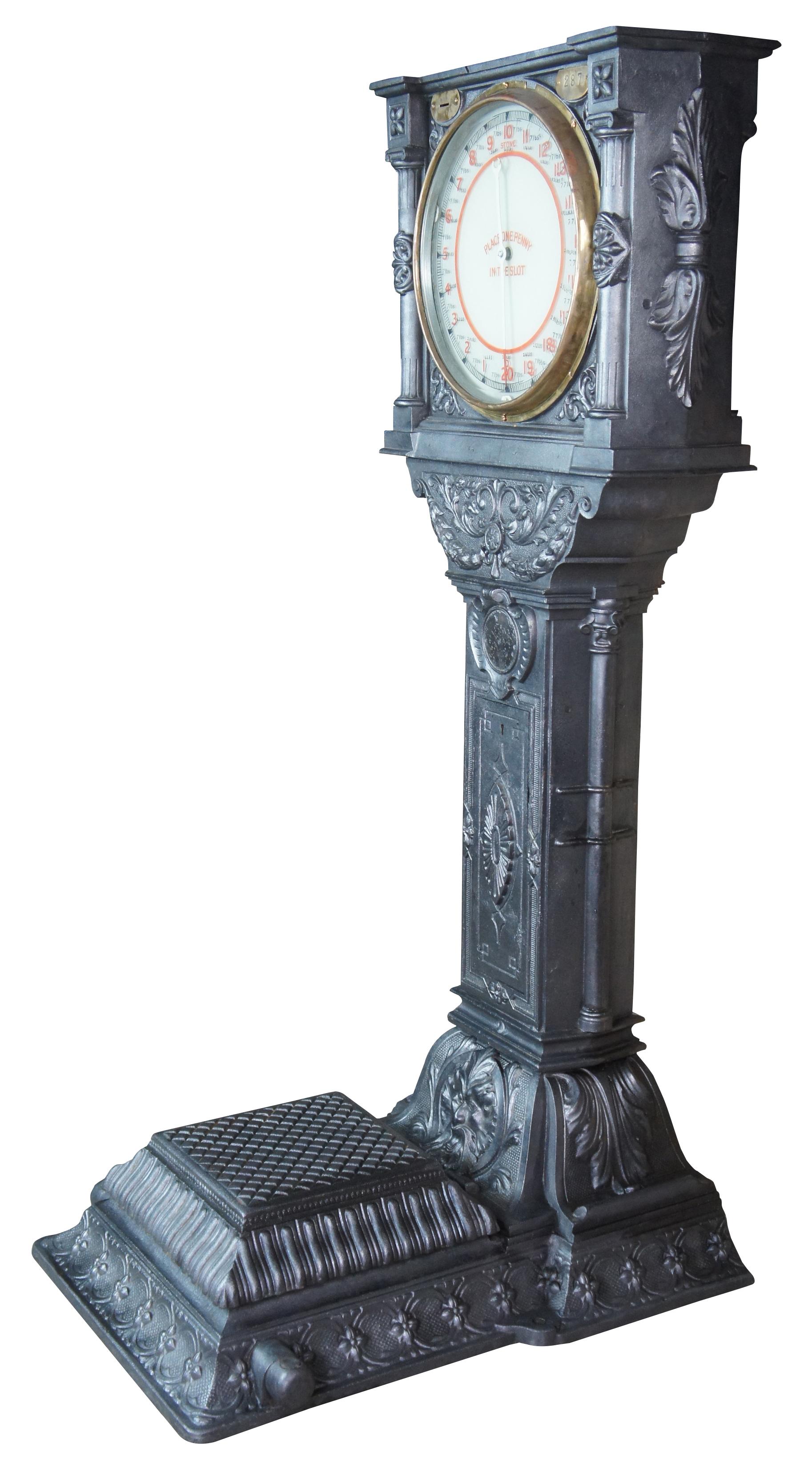 Exquisite museum quality English Imperial penny scale, circa early 20th century. Attributed to Australasian Automatic Weighing Machine Co. Ltd. Made from heavy cast iron with a gunmetal finish featuring high relief scalloping, acanthus leaves,
