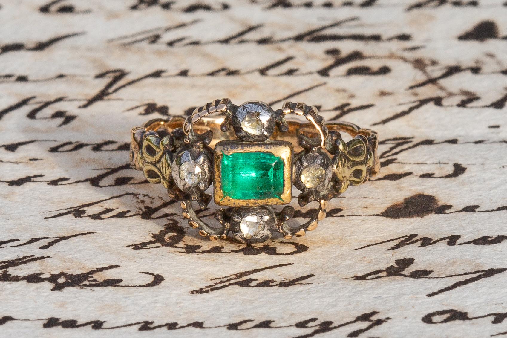 Rare Antique Late 18th Century Emerald and Diamond Ring 

This outstanding 18K gold ring dates to the late 18th century, circa 1780 and was made in Western Europe. A table cut natural emerald, likely to be of Columbian origin, is mounted in a gold