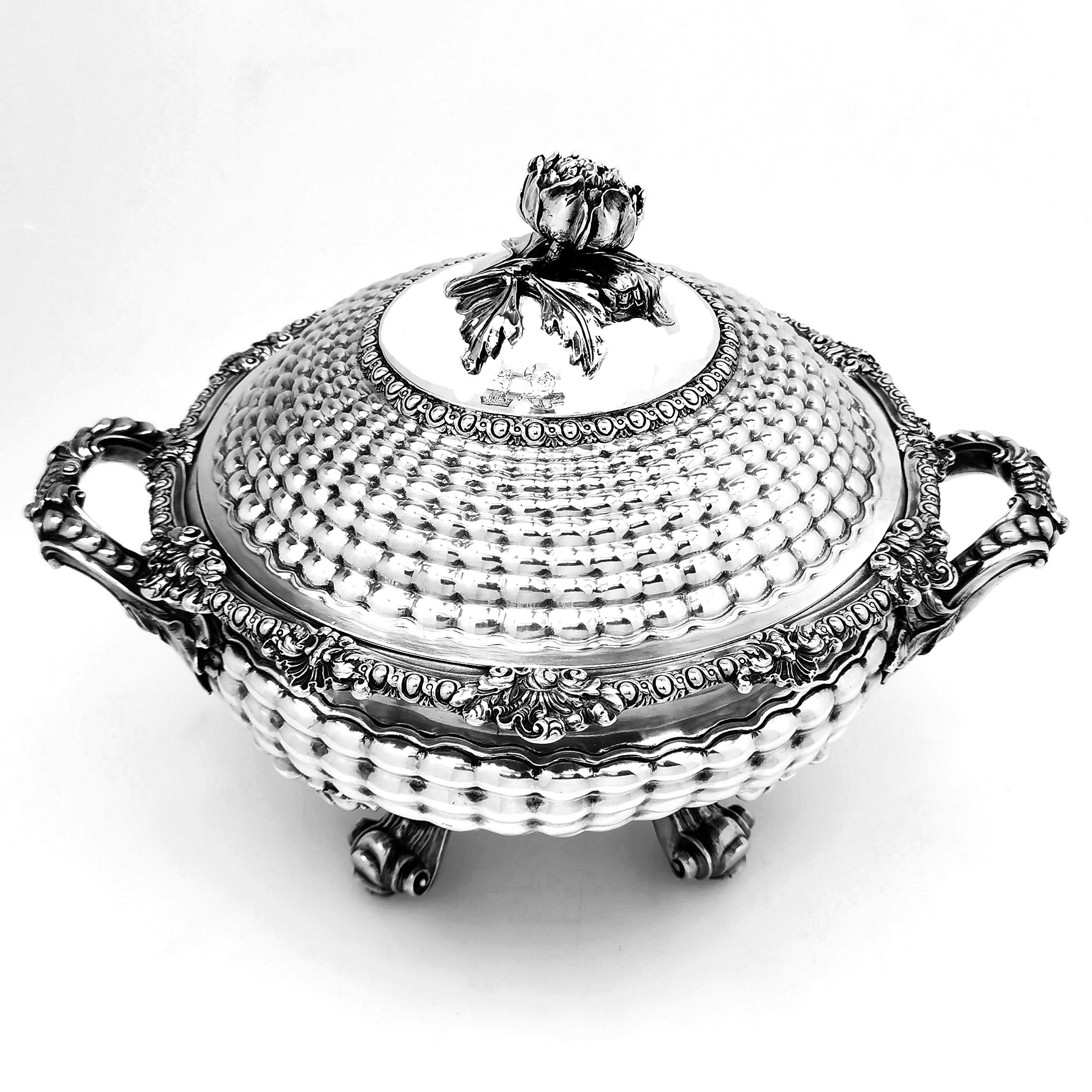 A magnificent antique George IV solid Silver Soup Tureen with an elegant chased quilted design. This round Silver Serving Tureen has Rococo elements perfectly accenting the quilted pattern on the body, with bold shell handles and a shell pattern