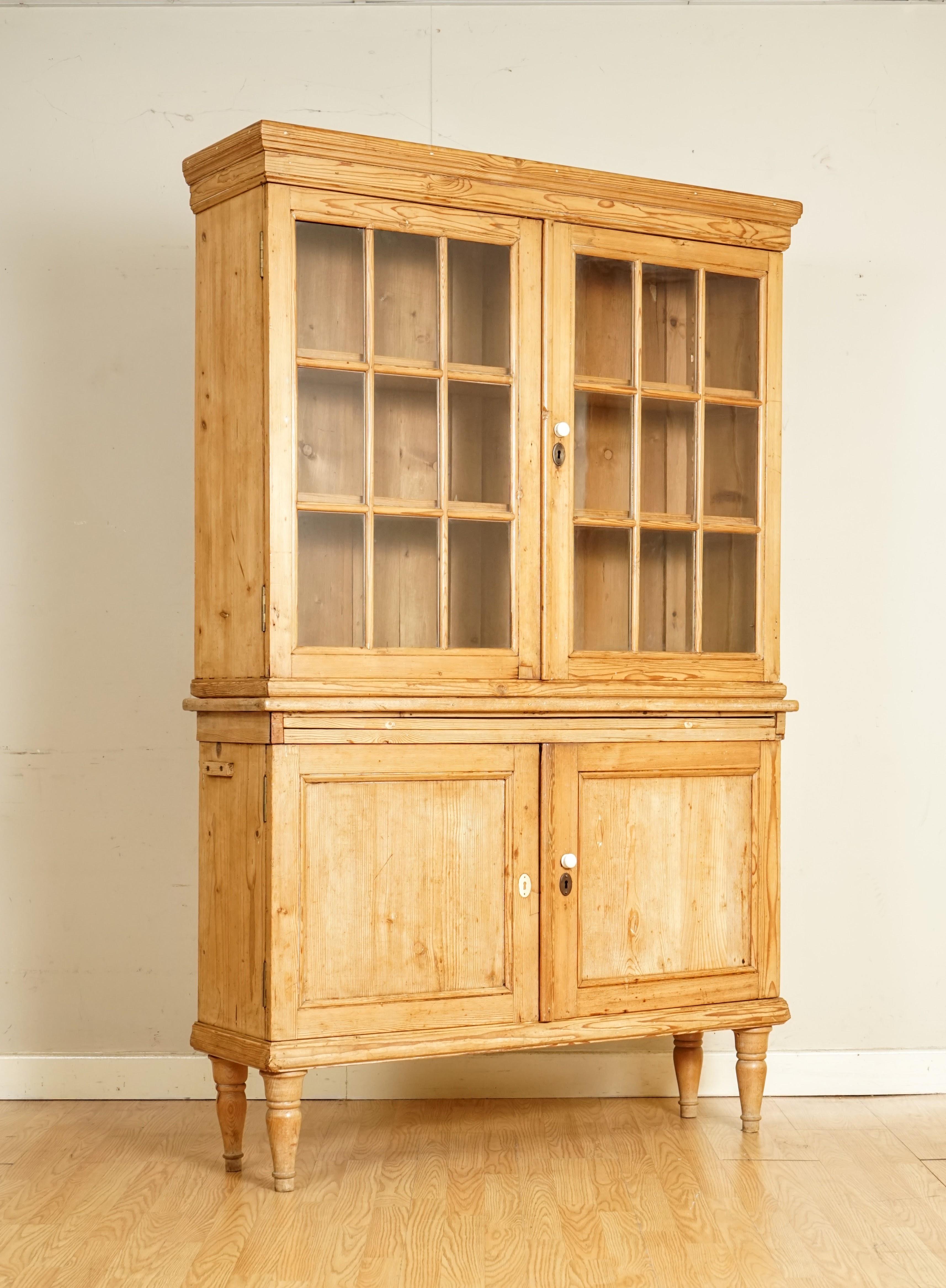 We are so excited to present to you this Lovely Unusual Distressed Farmhouse Pine Display Cabinet.

We have lightly restored this by giving it a hand clean all over, hand waxed and hand polish. 

Please carefully look at the pictures to see the