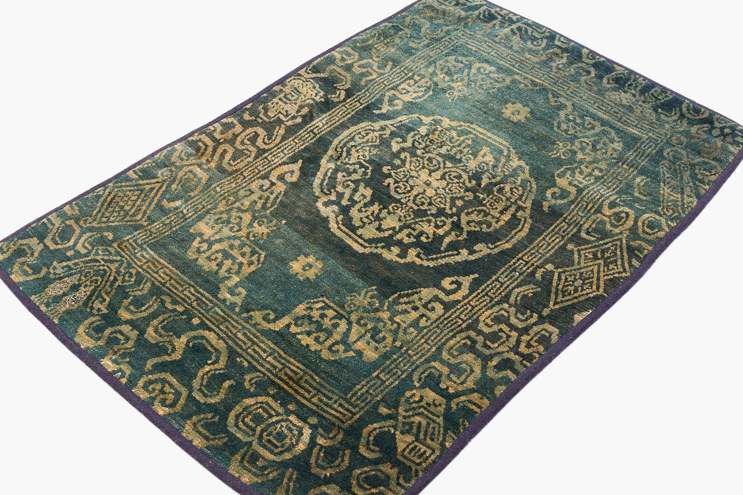 This antique meditation mat is special for its incredible dye and incredibly soft wool. The wool is so silky, we believe it is likely lambs wool. This rug uses incredibly beautiful greenish blue color derived from all natural dye. The border