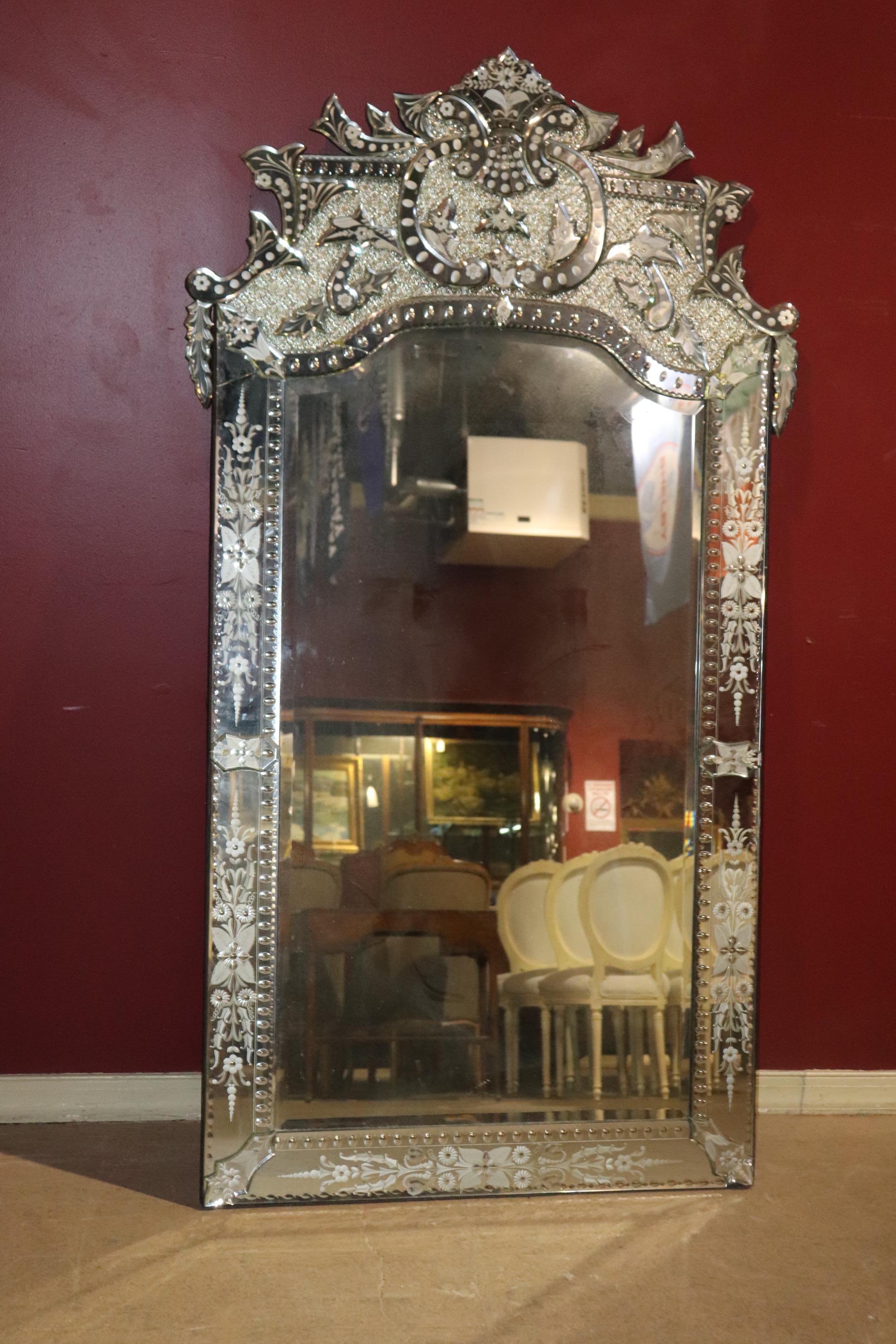 This is a fantastic Venetian mirror which while it does have some old age cracks and minor repairs like most Venetian mirrors of this era, but if properly hung in the air you won't notice these issues at all. This is a nearly 7 ft tall mirror so it