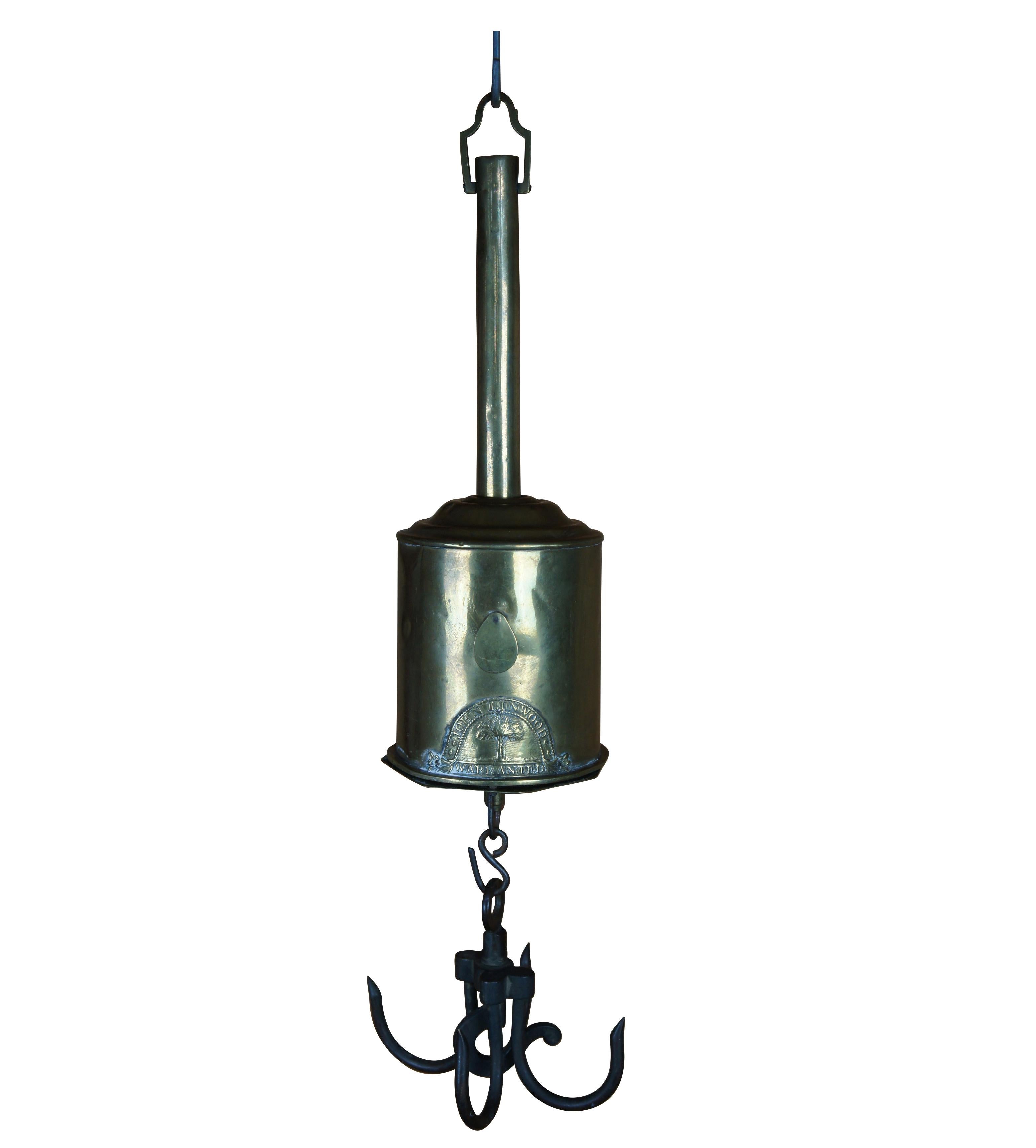 Antique John Linwood clock works Bottle-jack or meat-jack (also called roasting jack or spit jack). Made from brass and used for rotating meat on a spit. The case is shaped like a bottle with clockwork motor in a cylinder on an octagonal base with