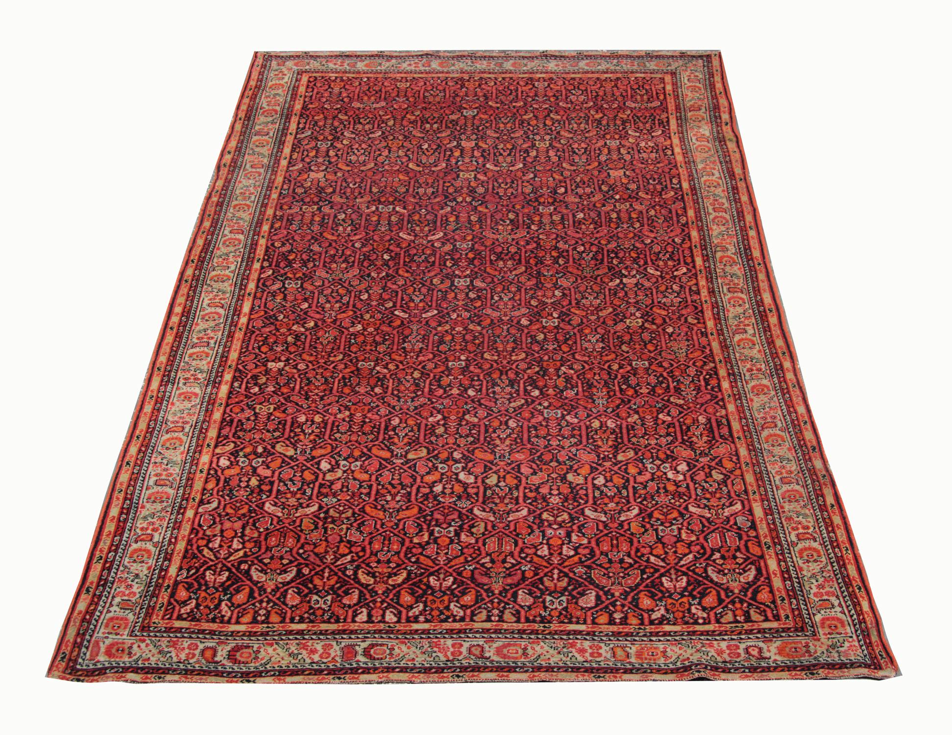 Yellow and red have been woven into a highly-detailed design in this antique rug Caucasian area rug, handwoven in Azerbaijan in 1880. The Malayer rug features a stunning all-over design woven on a red background with floral patterns in a geometric