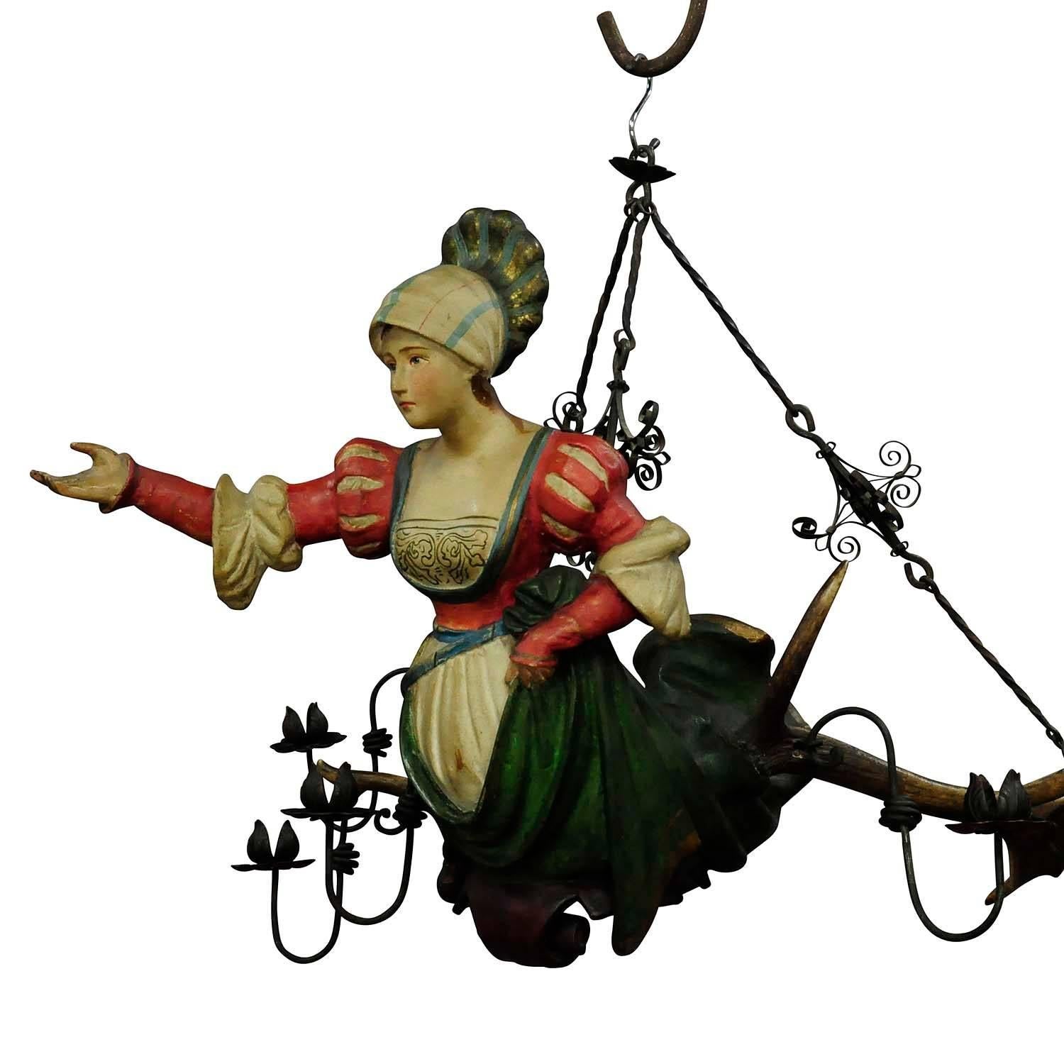 A rare antique lüsterweibchen chandelier with a papier-mâché sculpture of a Victorian lady with original antlers. Executed, circa 1890.

Measures: Length: 27.56