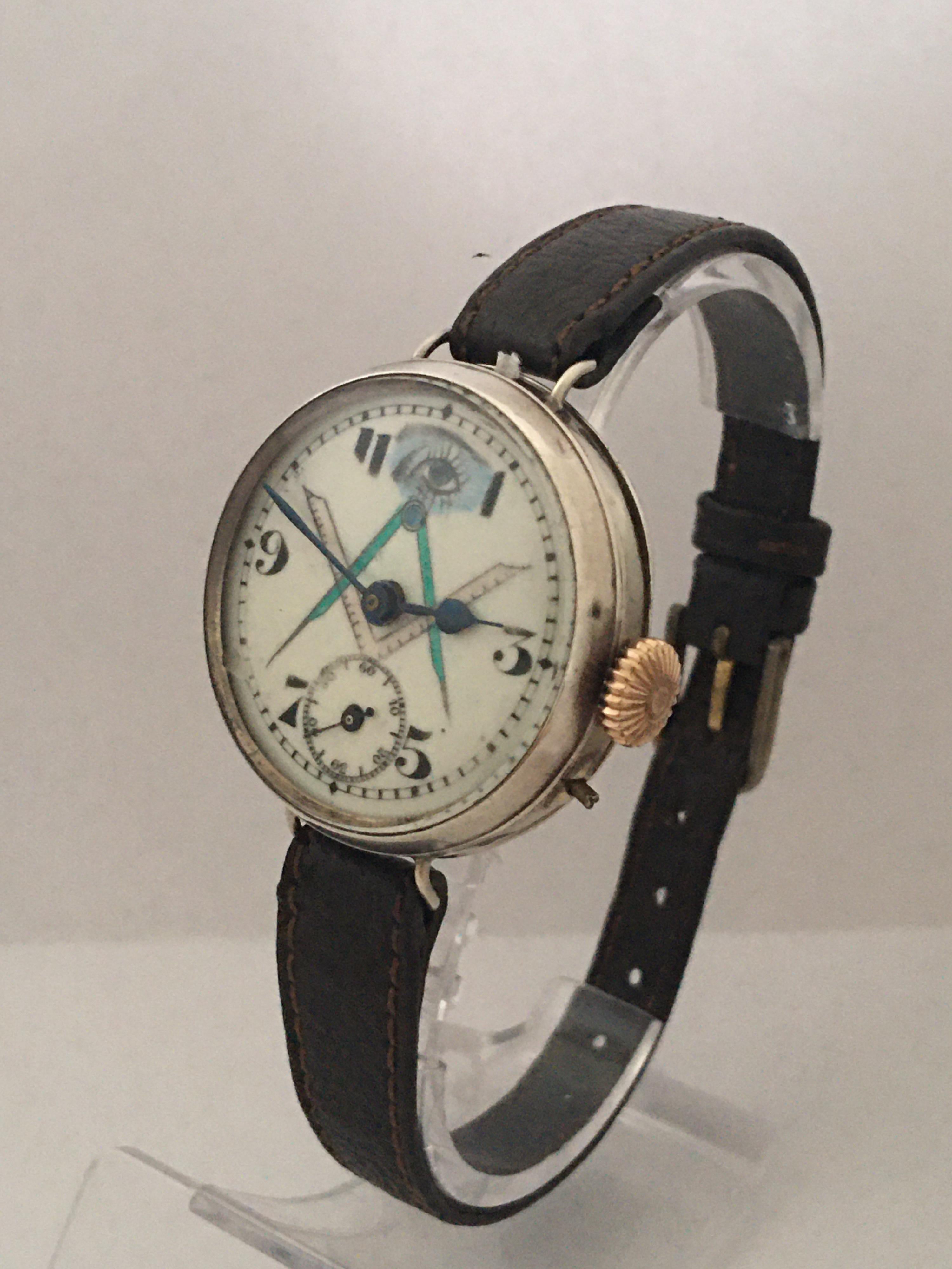 This Beautiful &  Rare Pre-owned Manual winding pin set Masonic Trench Watch is working and it is ticking well. 

Visible signs of wearing which has some slight scratches and minor dents on the watch case as shown and the strap is worn. 

Please