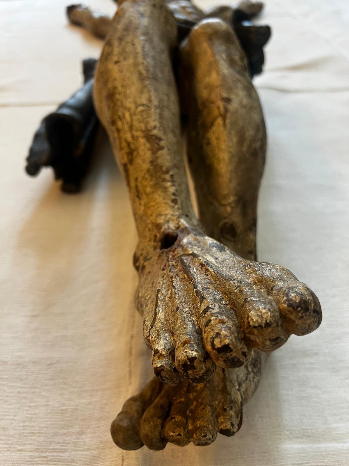 An extraordinary and museum-worthy 14th/15th century Gothic Corpus Christi, masterfully hand-carved in wood with exceptional anatomical detail and partially polychromed in white and royal purple. This monumental devotional sculpture stands 145 cm