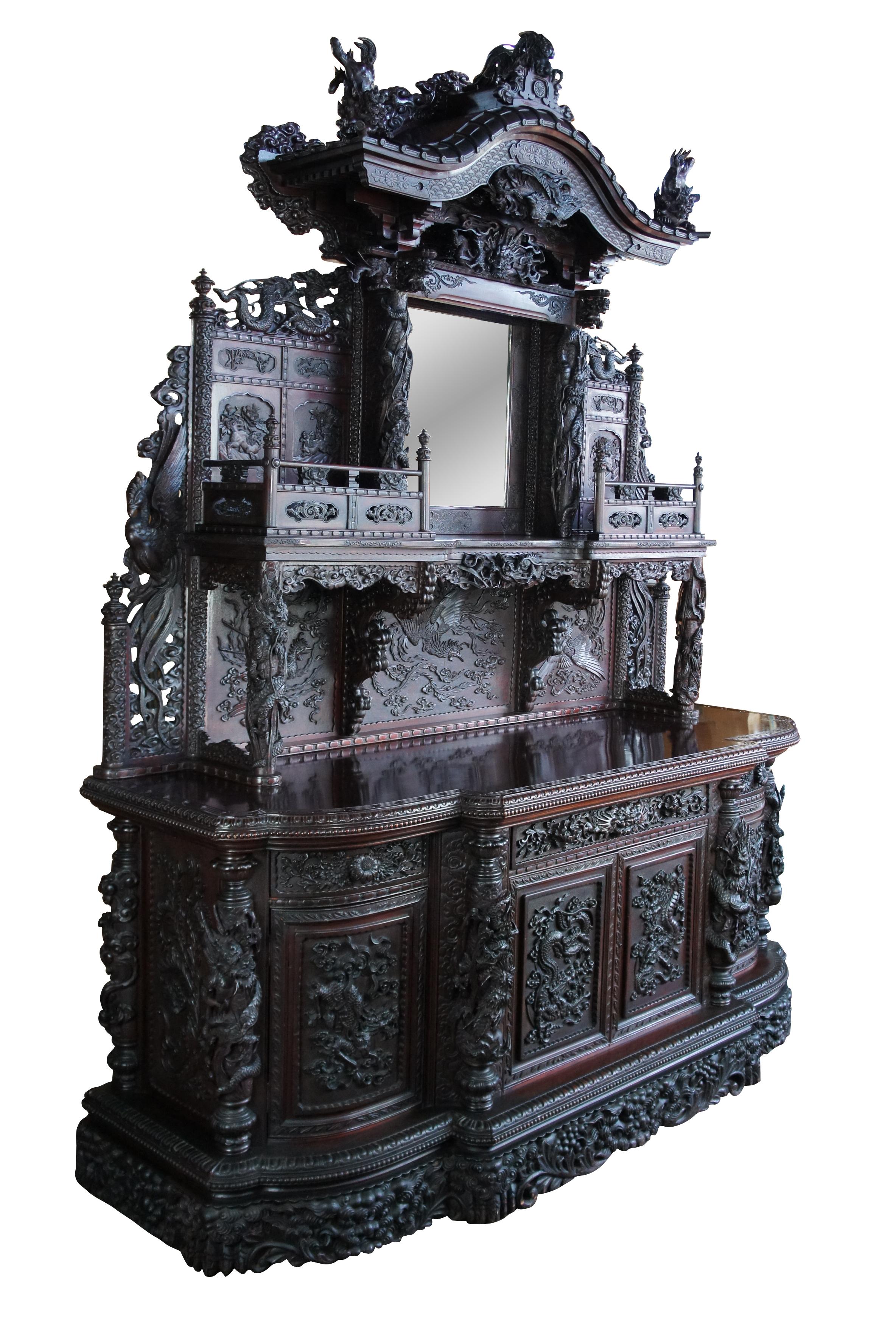 Important 19th C. Japanese Meiji Period ornately carved extreme high relief, credenza or bar back. Meticulously designed with one of a kind tooling. A breakfront form with three drawers over lower cabinets, topped by a hutch with shelves and central