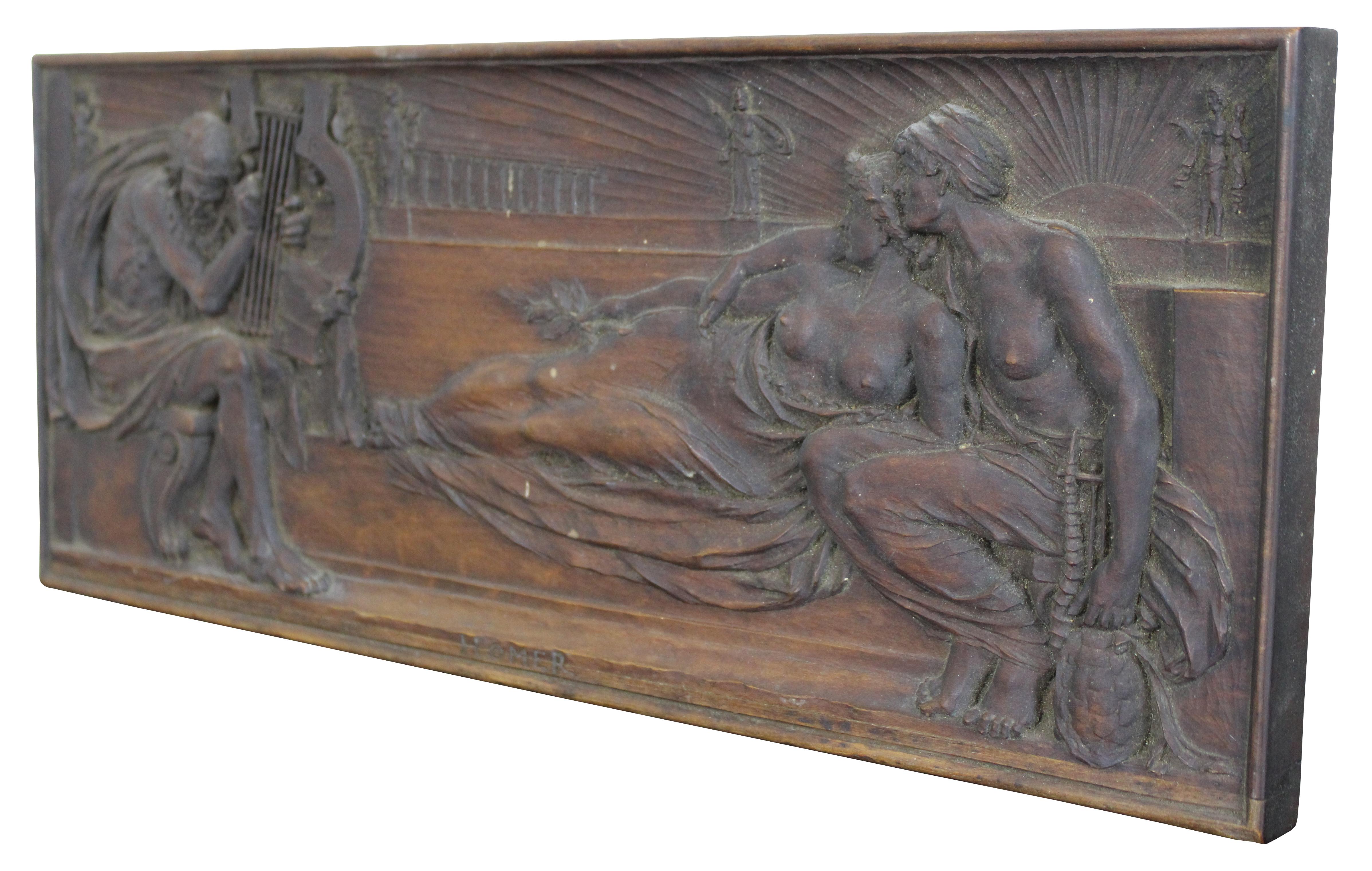 Rare antique carved wood reproduction of a clay relief sculpture by Harry Bates, depicting the Greek poet Homer, playing the lyre for two Muses. “The famed Greek epic poet Homer is said to have flourished around 700 B.C. Credited to him are the