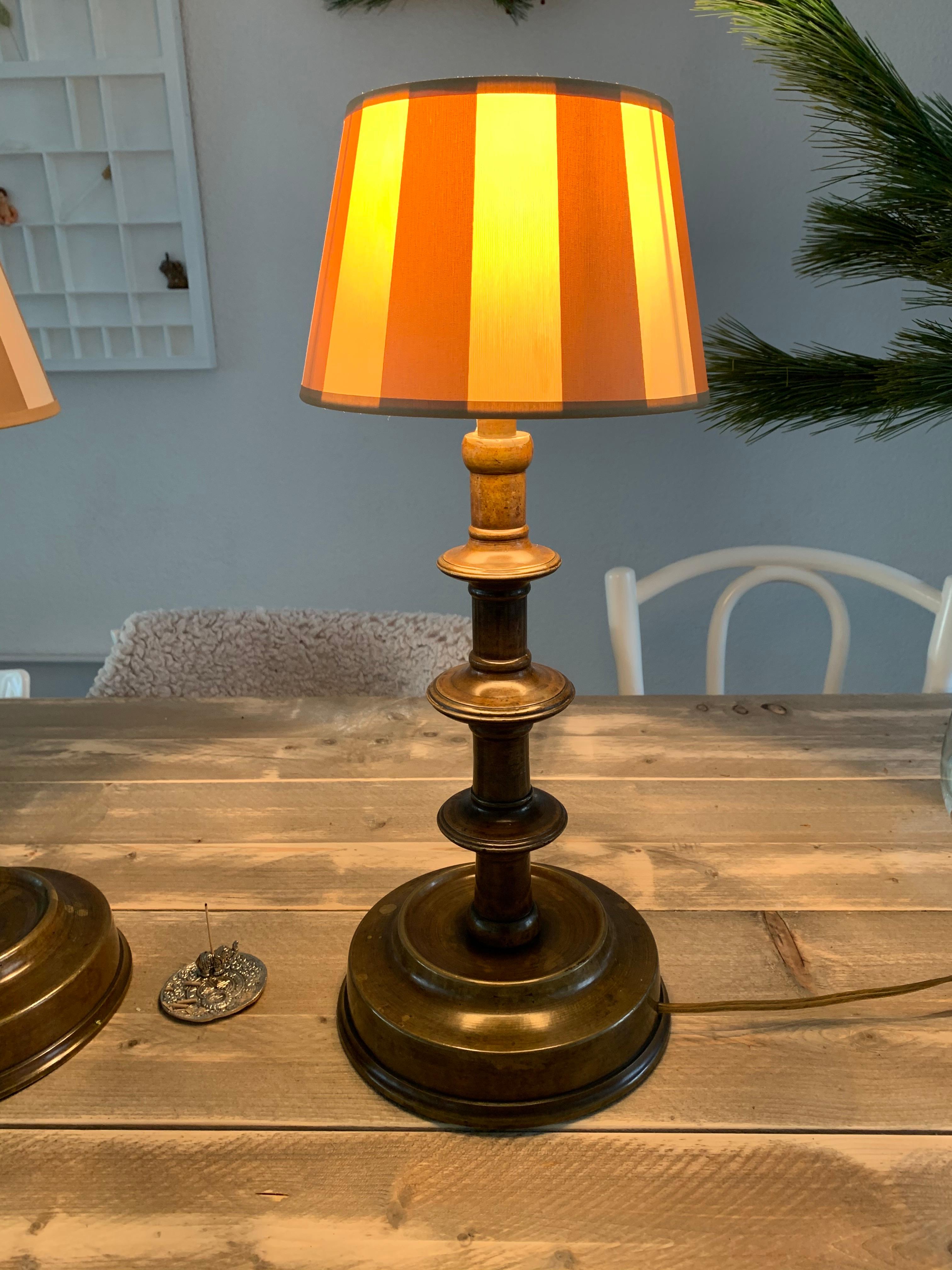 Good size, great quality, antique bronze table lamps with an amazing patina.

We are always on the lookout for antiques that have something extraordinary about them. With these electrified, former church candelabra table lamps, three features make