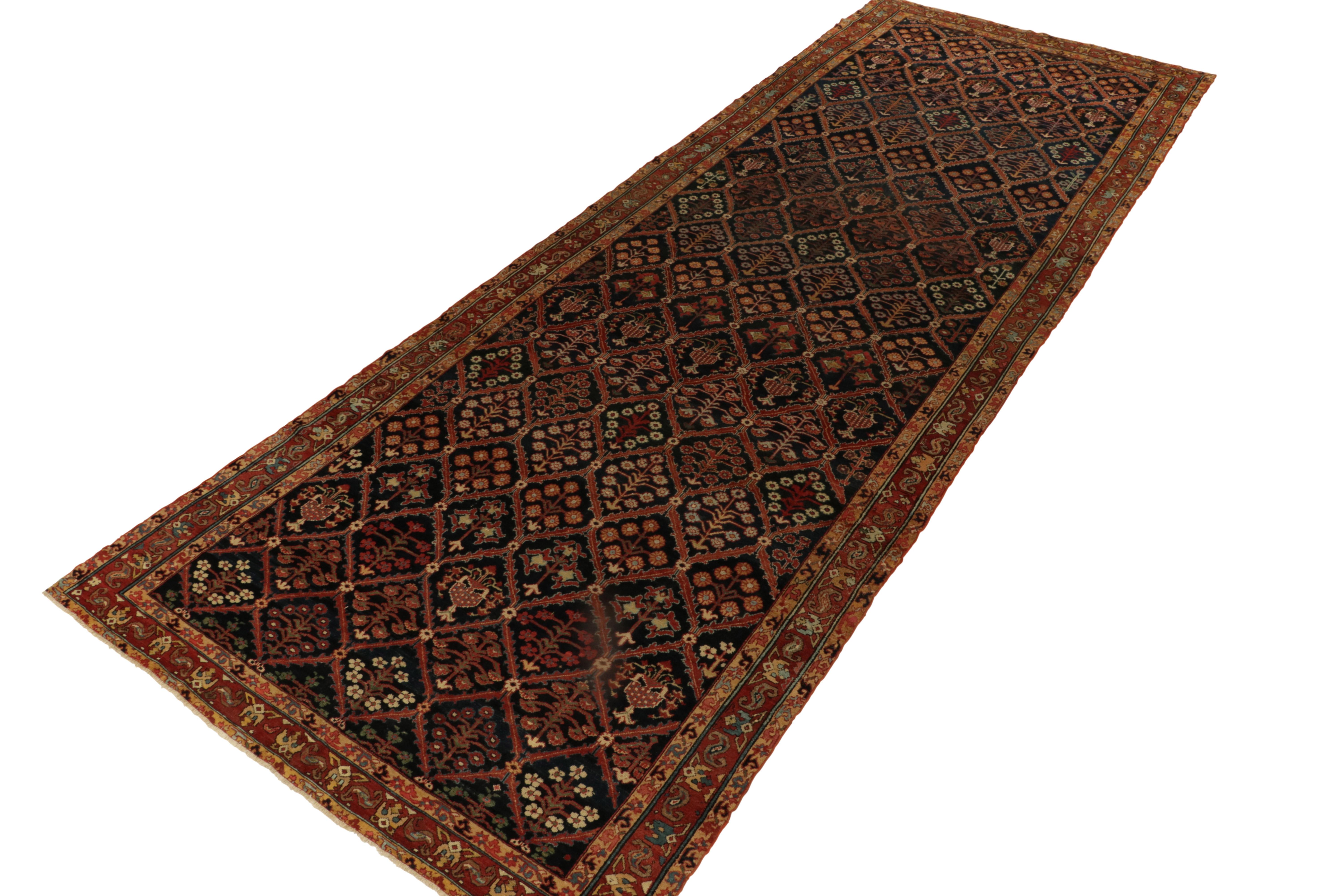 A rare 7x19 antique Persian rug of Joshaghan provenance, among the latest to join Rug & Kilim’s coveted Antique & Vintage curations. 

Hand-knotted in wool circa 1850-1860, gorgeous floral patterns flourish in a sophisticated, archaic play of rich
