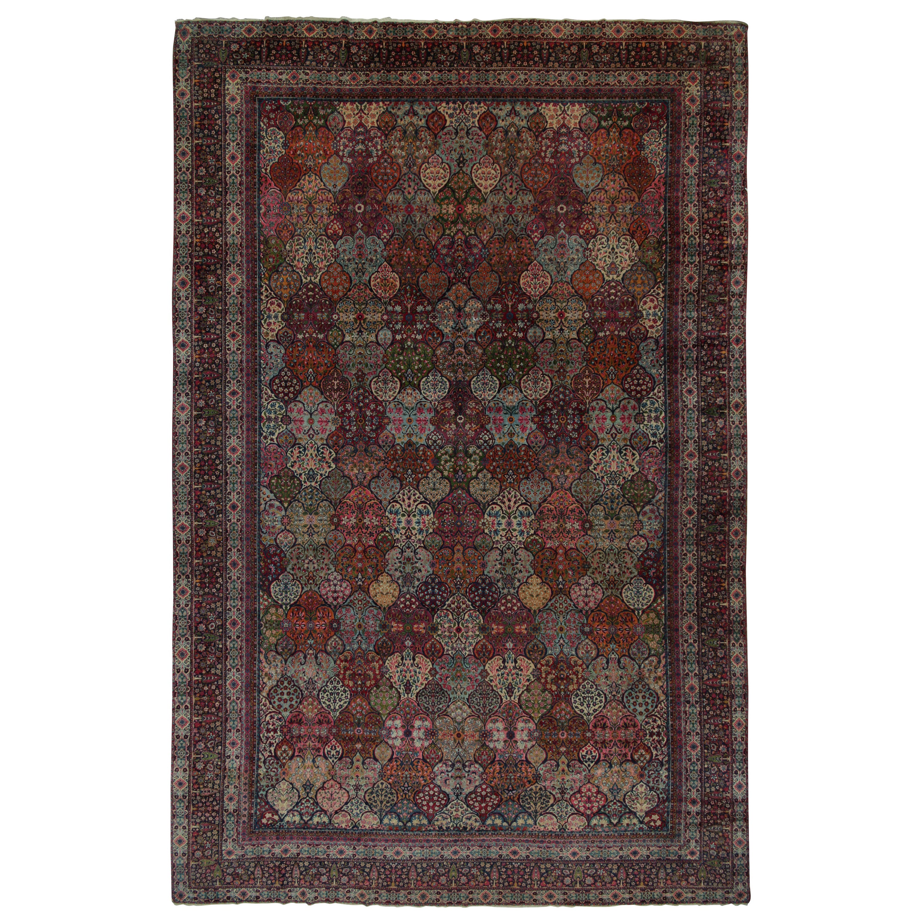 Seltener antiker persischer Kerman-Teppich in polychromem Blumenmuster von Teppich & Kilim
