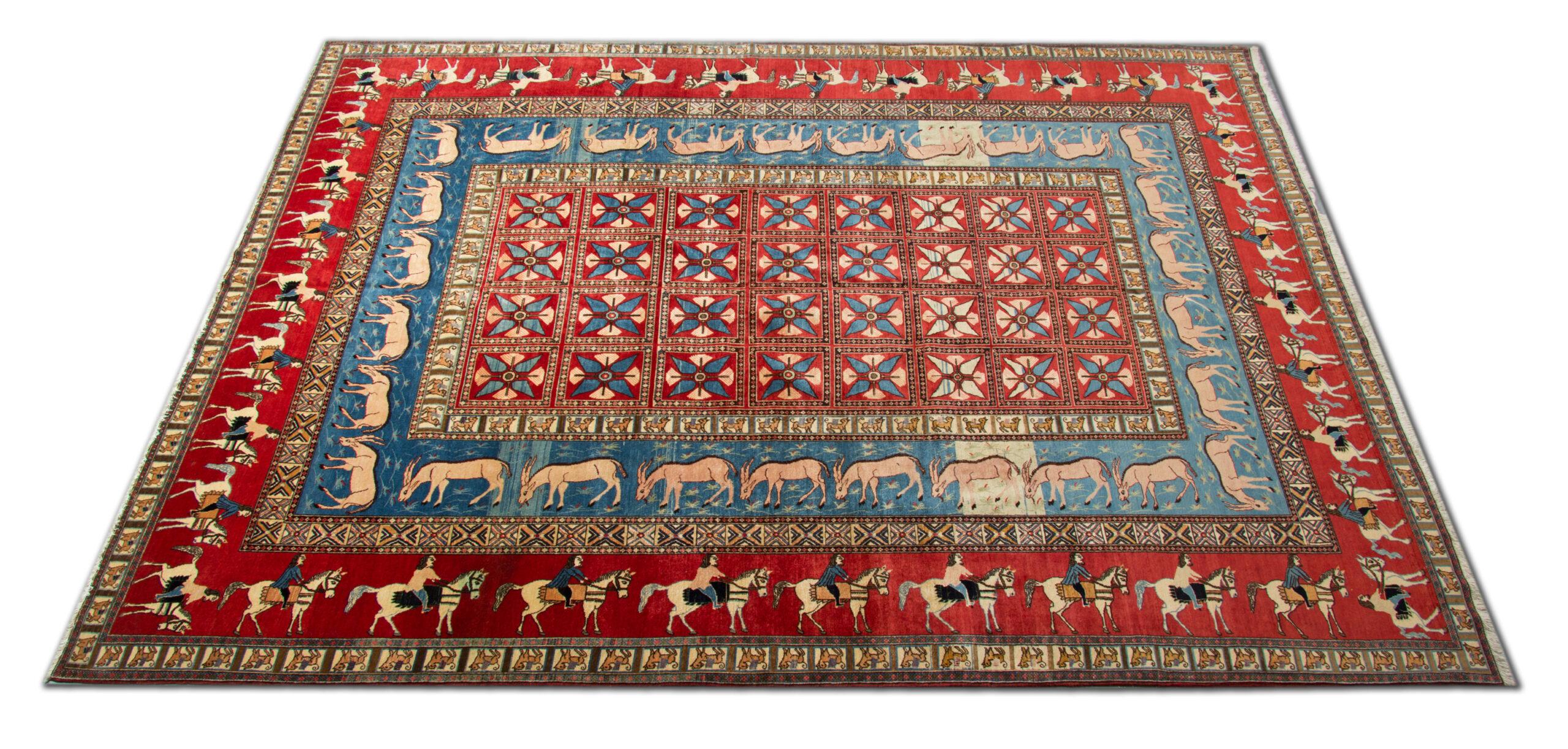 This Collectibles Persian Semnan Carpet is rare due to its unique design and colouring. The design features a unique layered repeat pattern border with realistically woven horses and riders on a red background, followed by Rams on a blue background.