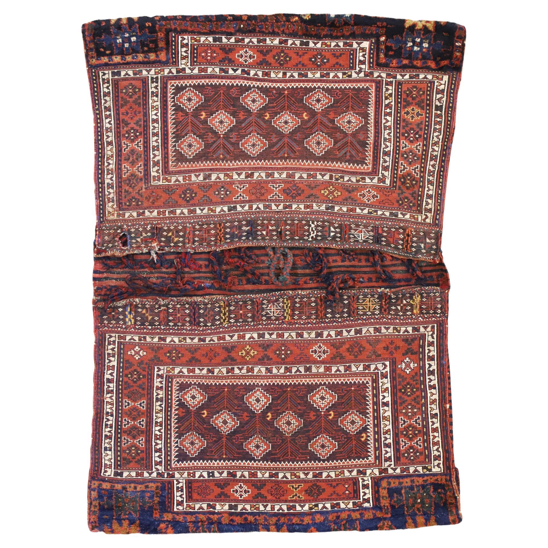Rare Antique Persian Soumak Saddlebag, Nomadic Charm Meets Versatility For Sale