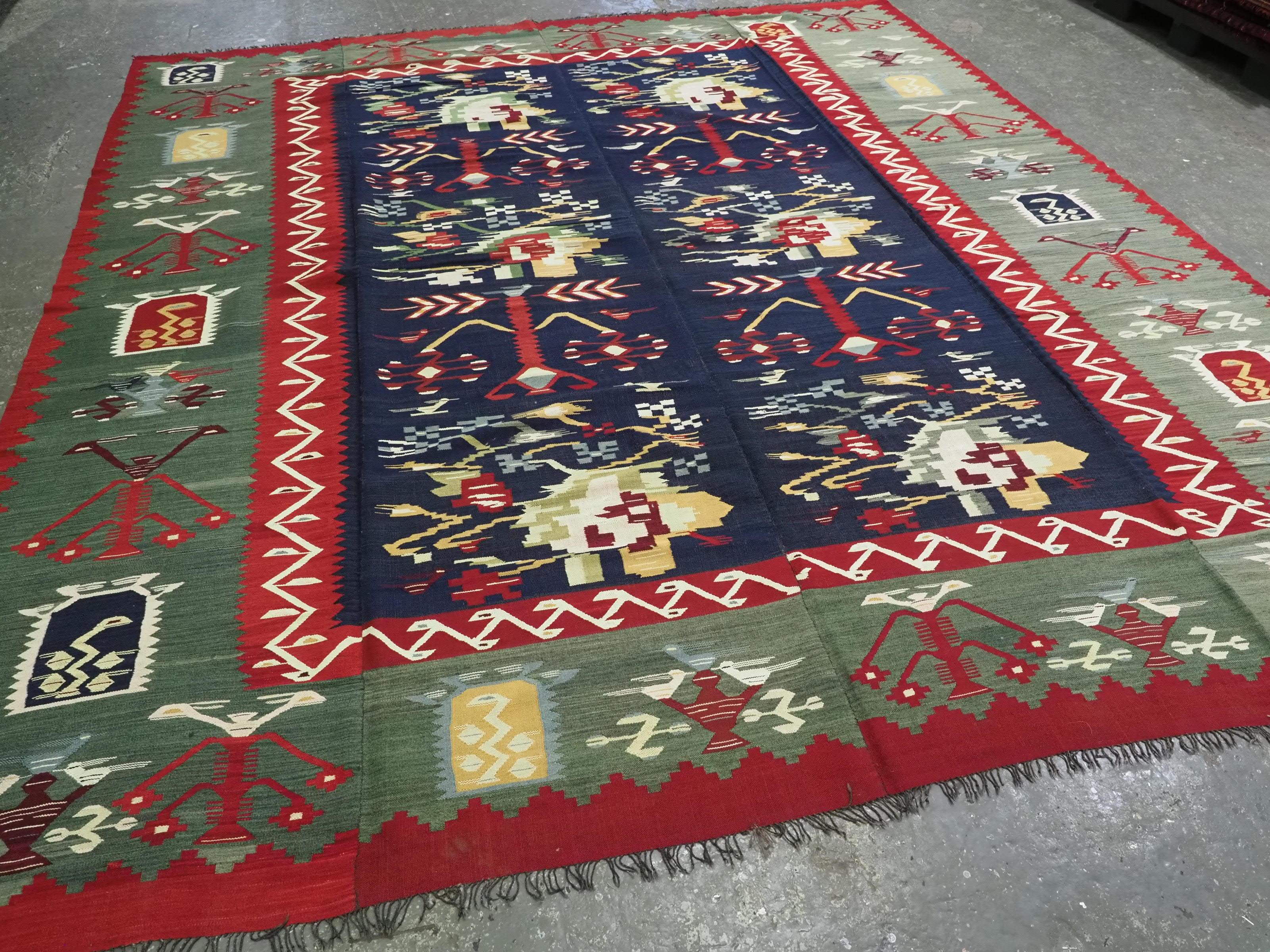 Size: 11ft 9in x 10ft 2in (357 x 310cm).

Rare antique Pirot / Sarkoy kilim of scarce design. A kilim of large room size, a truly outstanding example.

Circa 1920.

Pirot kilims are also known as Sarkoy or Sharkoy, they originate from the town of