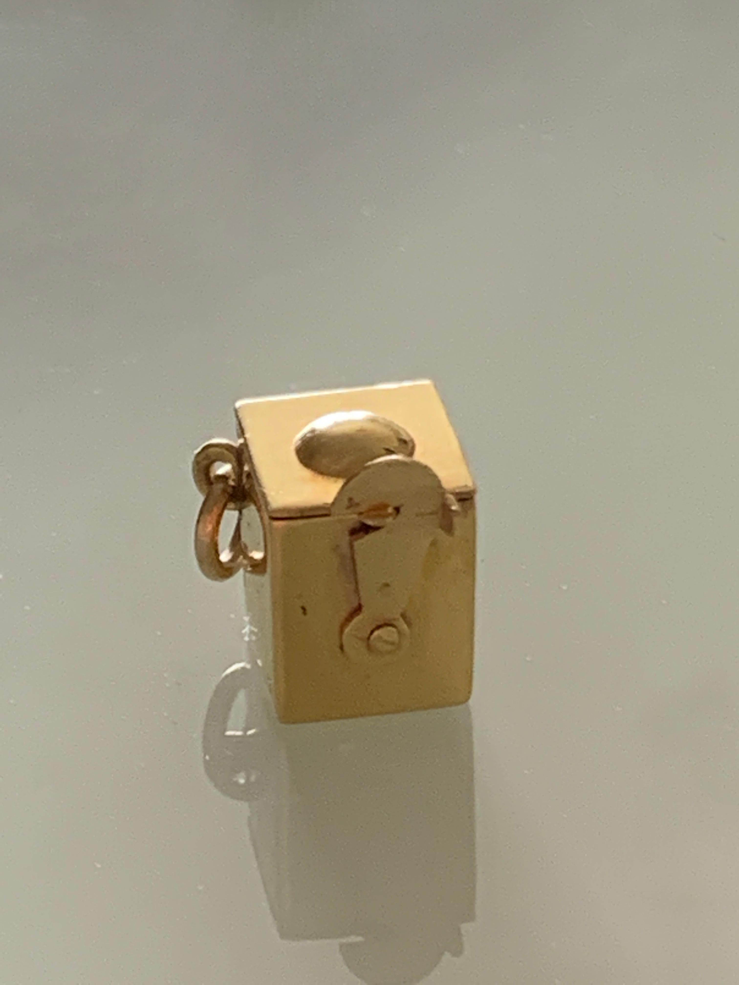 Rare Jack in a box charm
9ct Gold Box stamped 9ct beneath
Great large secure fastener
Jack has an enameled face and a navy blue collar
it seems he may have lost his hair 
Box is buttery bright gold .

