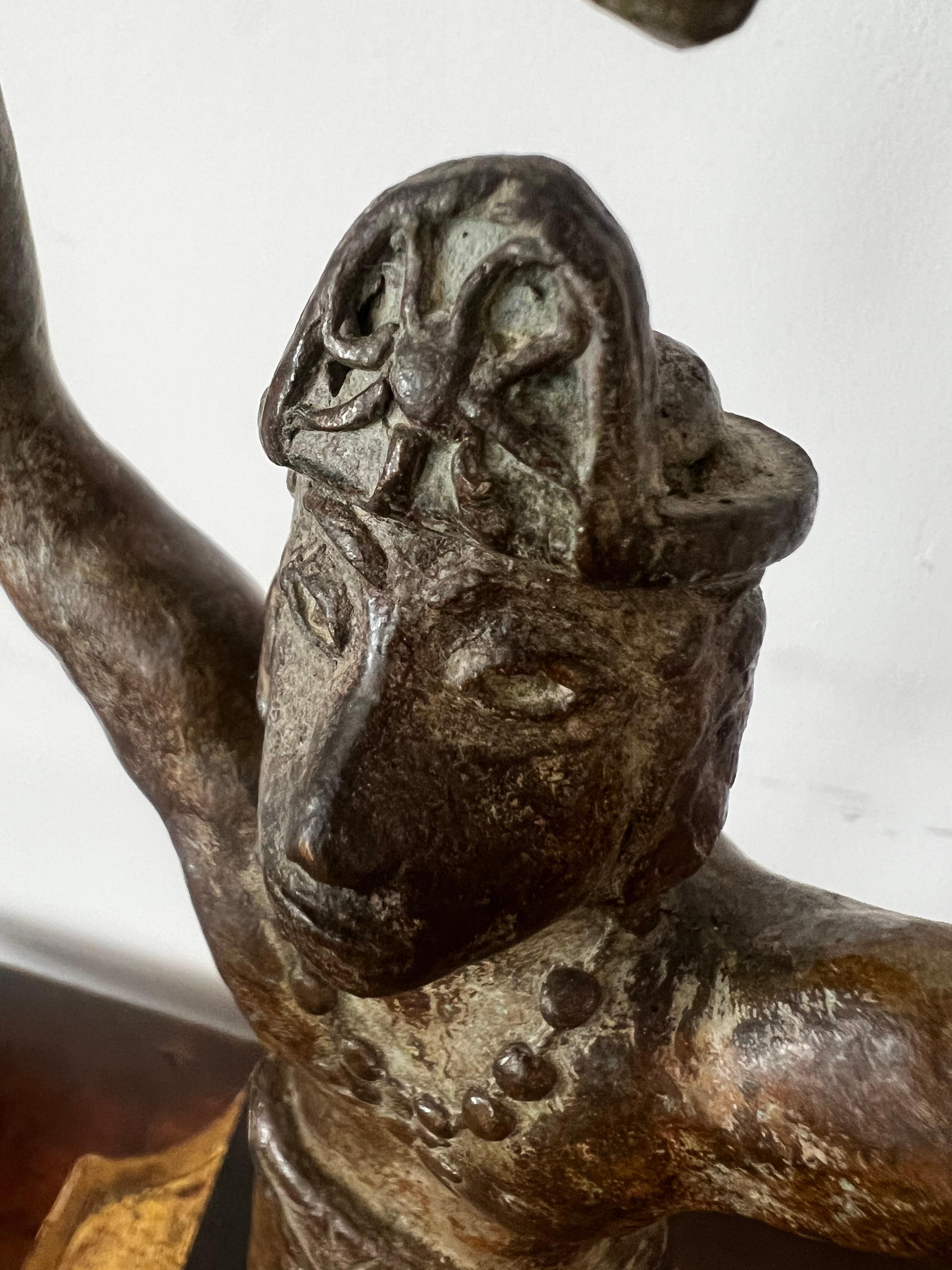 This is a very rare and extremely unusual figurative solid bronze handcrafted sculpture. The figure is most likely Inca-Mayan and worshiping Inti, also called Apu-punchau,-in Inca religion the sun of God. The work is incredibly detailed, starting