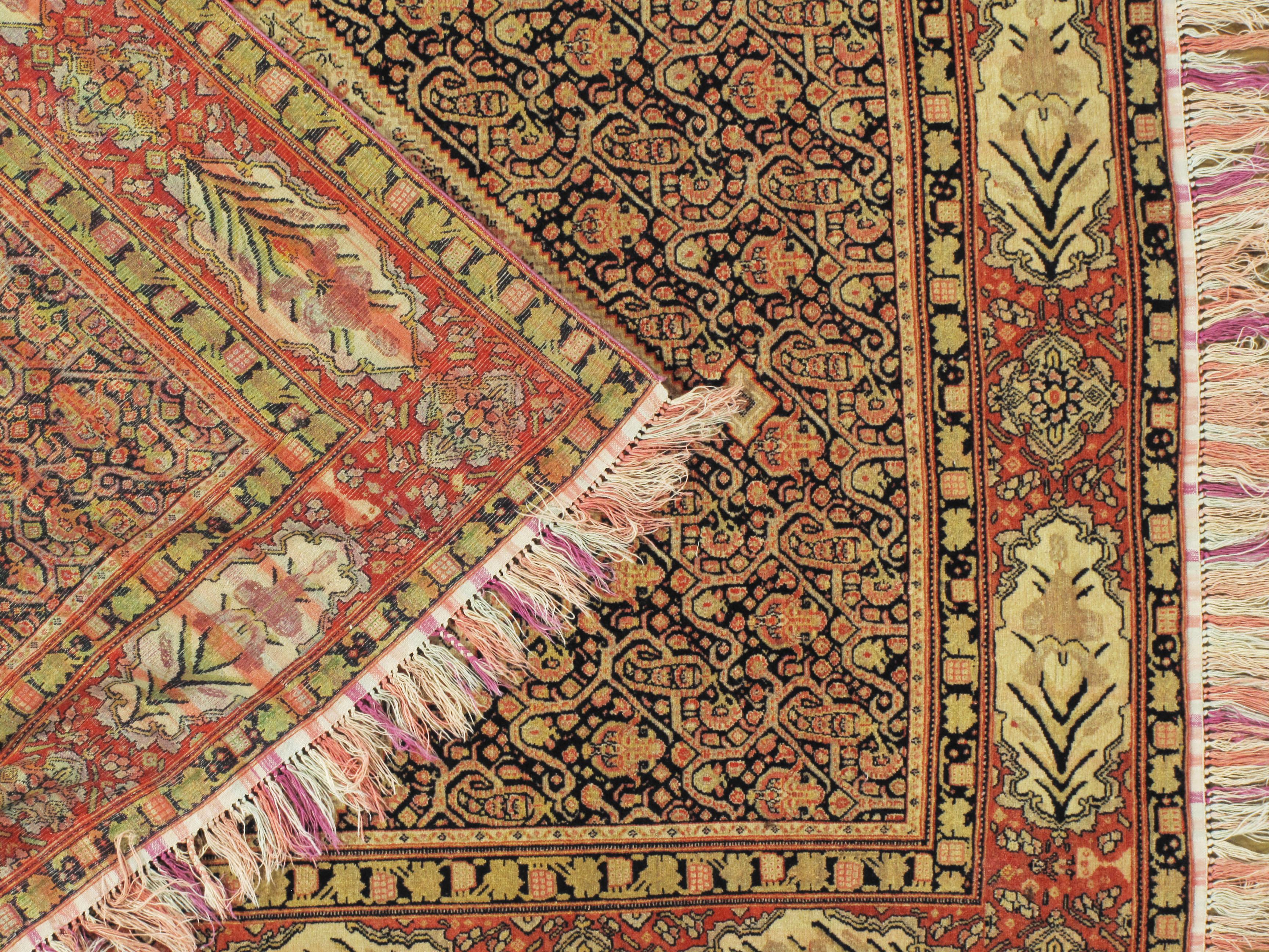 4'1 x 6'7. A very fine and rare antique Persian Senneh rug woven in wool on a silk foundation that gives the rug extra softness together with the beautifully colored silk fringes. From the town of Senha (Sanandaj) in Kurdistan come antique rugs that