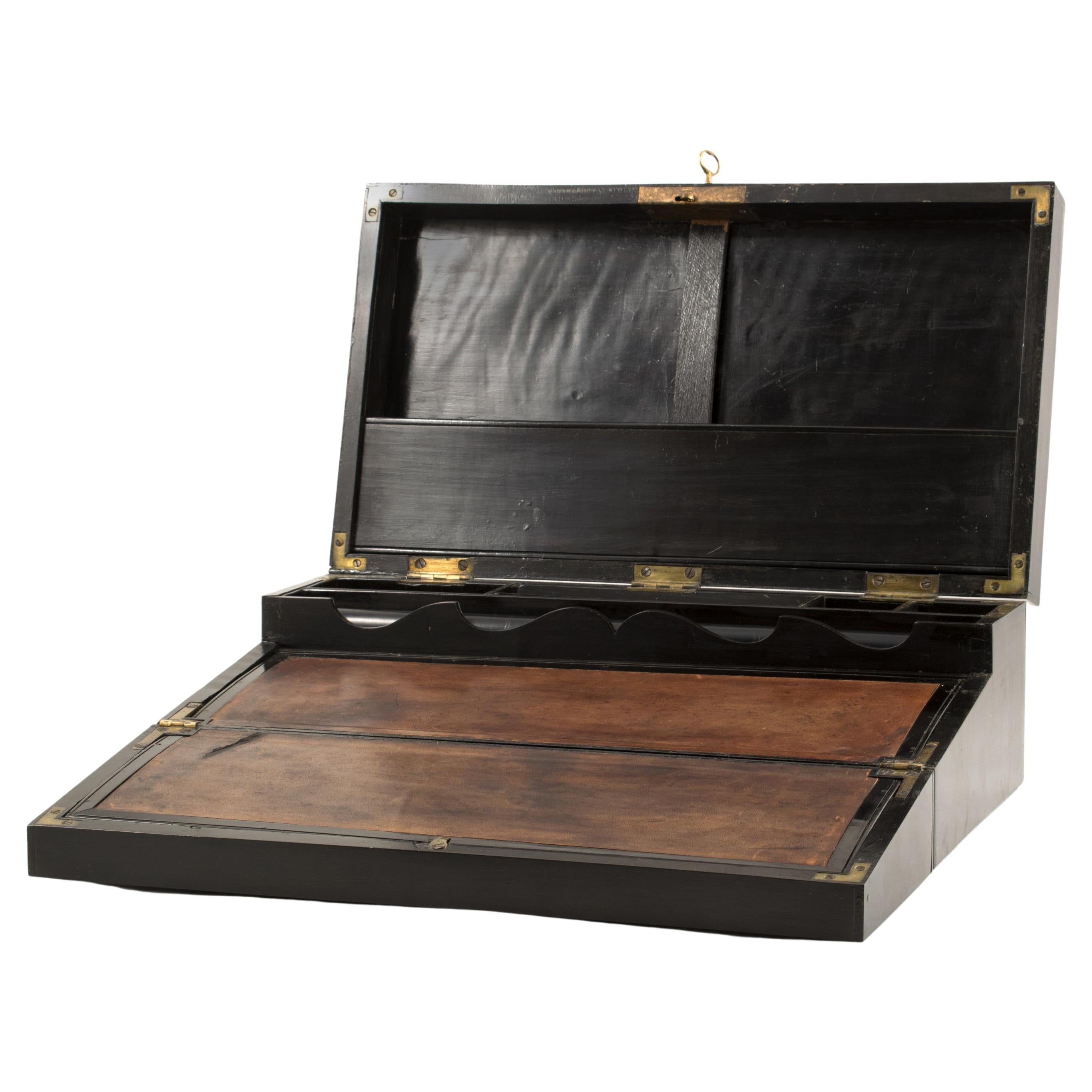 A rare Regency writing desk box made in solid ebony.
Original leather with natural age-related patina.
Original fittings and locks.

In good condition and untouched original.
England 1810 - 1820.