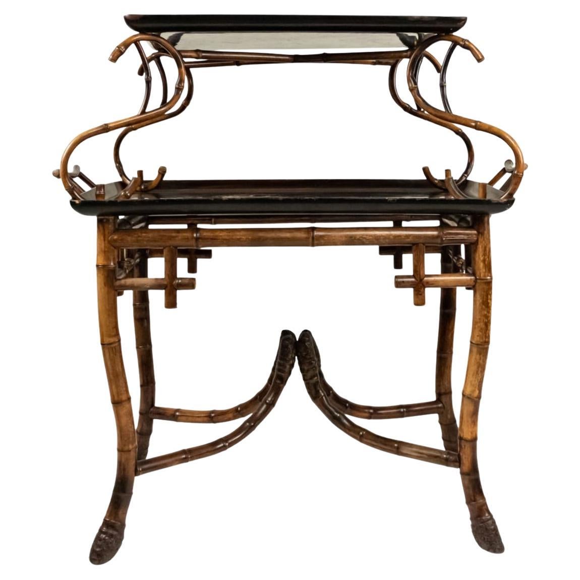 Just in this, this rare and  exceptional French Japonism Root Bamboo,  two tier Lacquer tray table c, C1870-1890.
This table is by the famous Maison Perret et Vibert.
There are two beautiful hand painted trays attached to the piece in a Japonisme