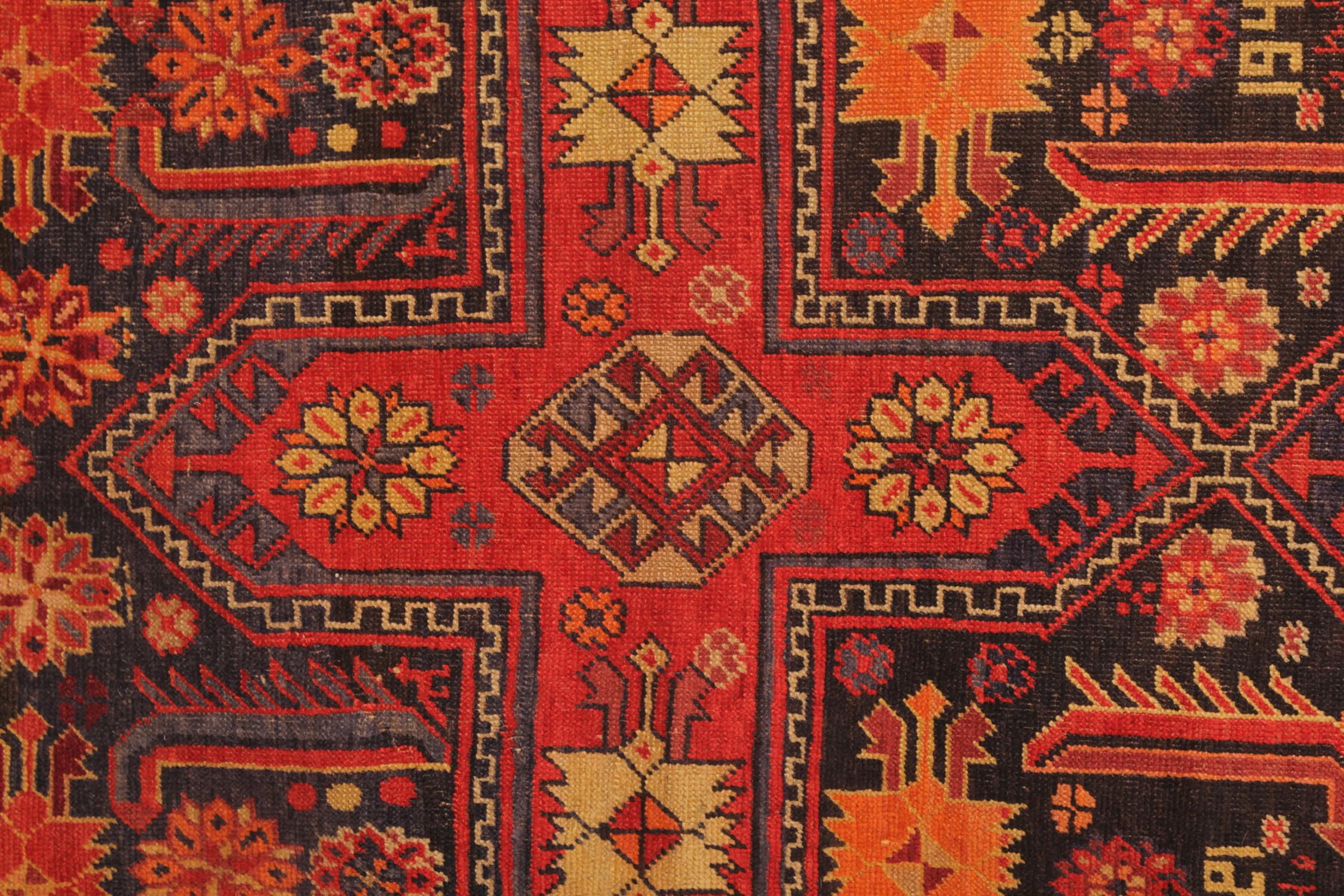 Bold Red and deep blue colours drench this vintage Caucasian Area Rug. Featuring tribal motifs in a repeat cross pattern through the center this is then enclosed by a highly detailed border. Woven in Iran, with handspul wool and cotton, this tribal