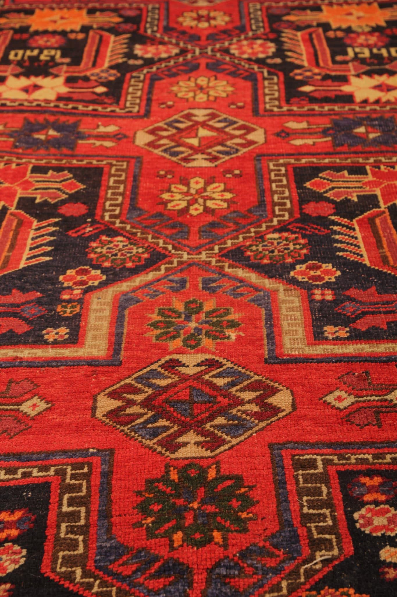 This rare antique rug from the Kazak area is a true treasure for collectors and enthusiasts alike. Handmade with meticulous care, its exquisite craftsmanship showcases the rich heritage of Caucasian weaving traditions. Dating back to the 1950s, this