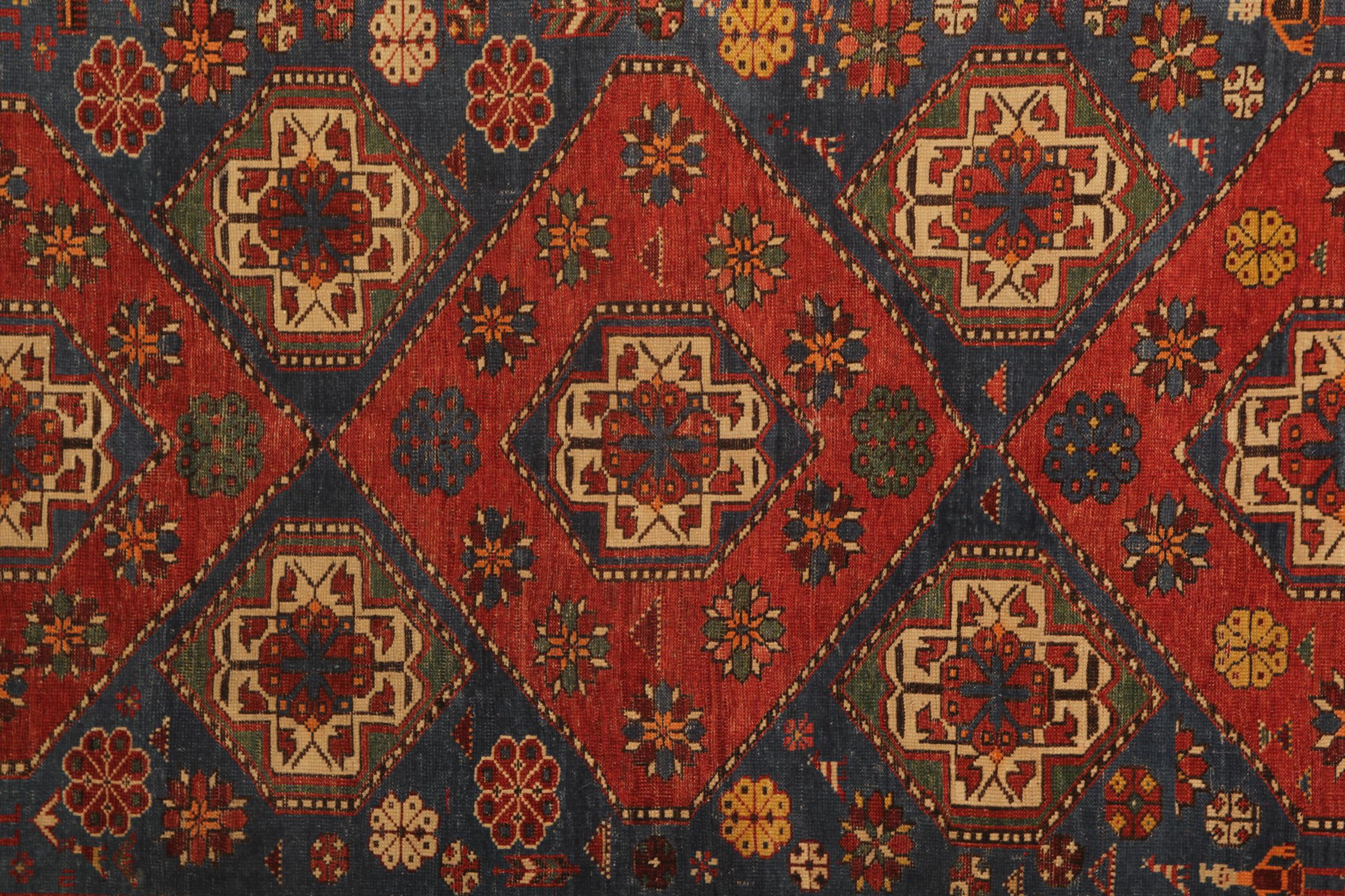 This antique shirvan features beautiful orange and red tones woven in a tribal geometric design with a highly detailed central medallion and a multilayered border. This one-of-a-kind rug is perfect for use as a bedroom rug, living room rug, or any