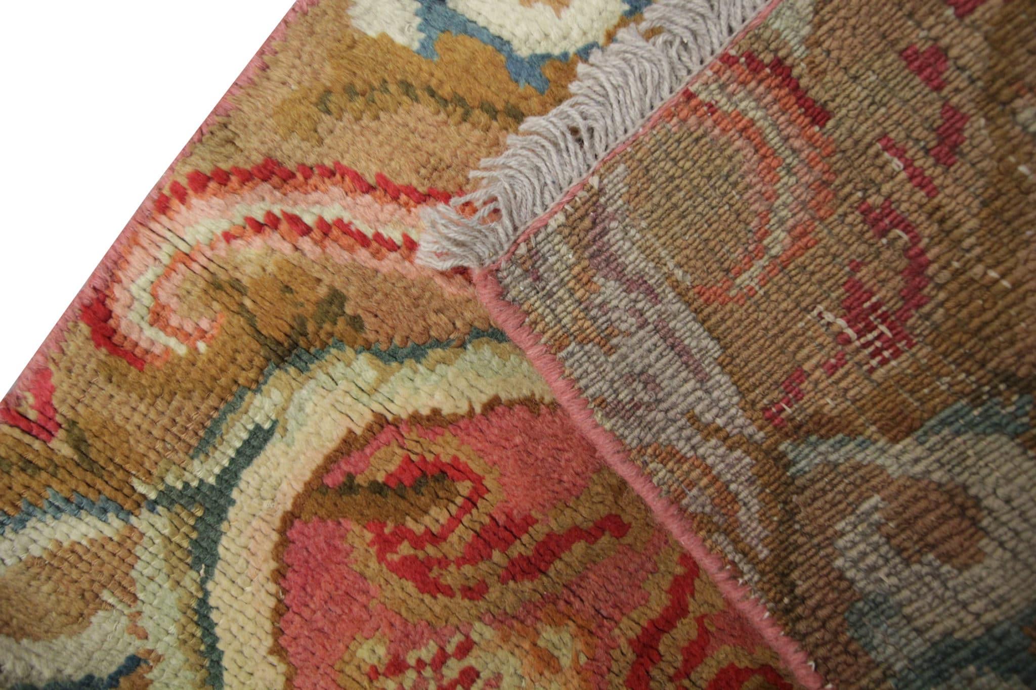 Step into the rich history of British craftsmanship with our rare antique rug english Axminster handmade runner. This exquisite piece, dating back to the 1870s, carries the legacy of traditional English rug making. Hand-knotted with meticulous care,