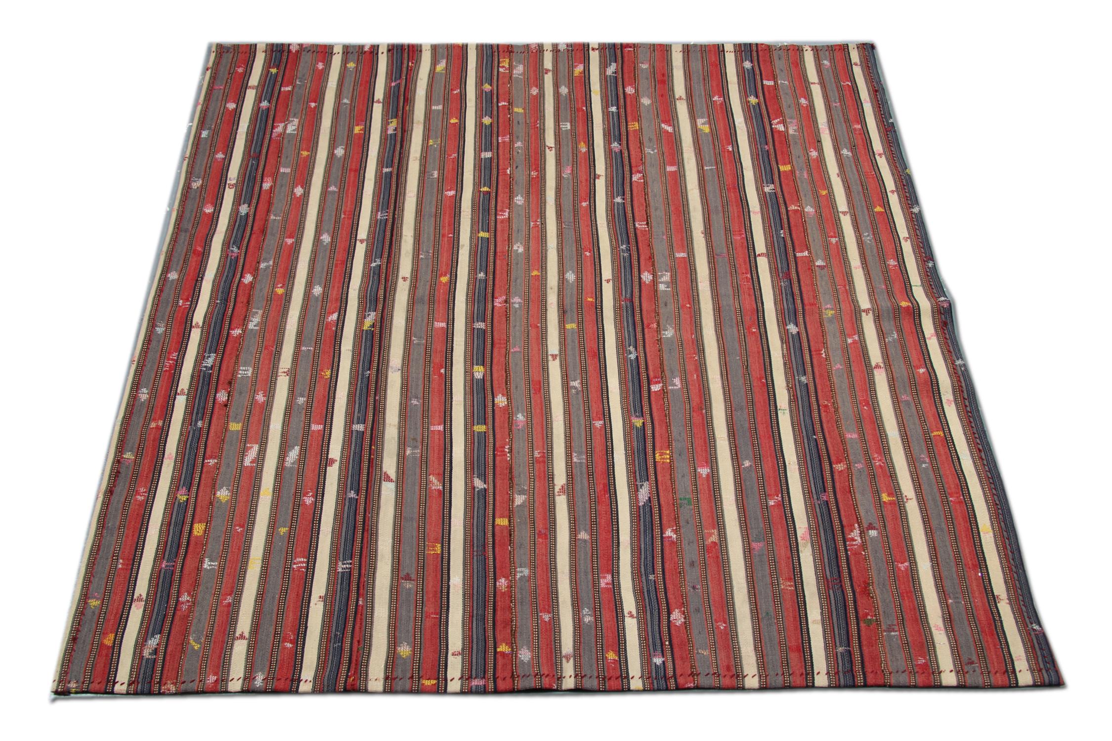 This unique textile is in great condition; it features a simple stripe design woven in red, blue, and cream colors with specks of colour dotted throughout. The traditional stripe design and the simple colour palette make it suitable for any home