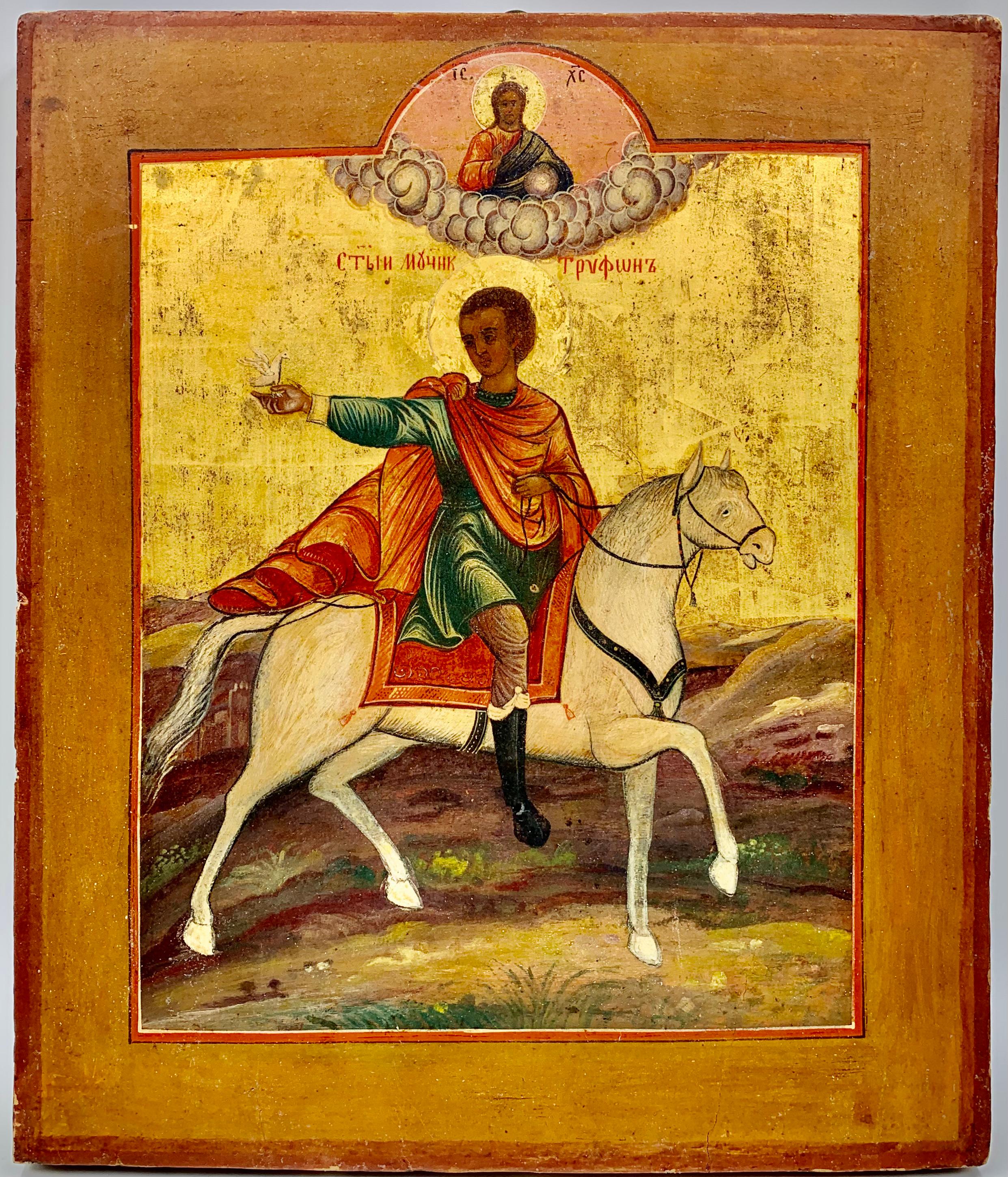 Exceptionally rare antique Russian Icon of Saint Tryphon, the Patron Saint of wine growers, restauranteurs, falconers. 
Saint Tryphon's saint day is February 14th, according to the Old Calendar, which is the time for wine growers to prune their