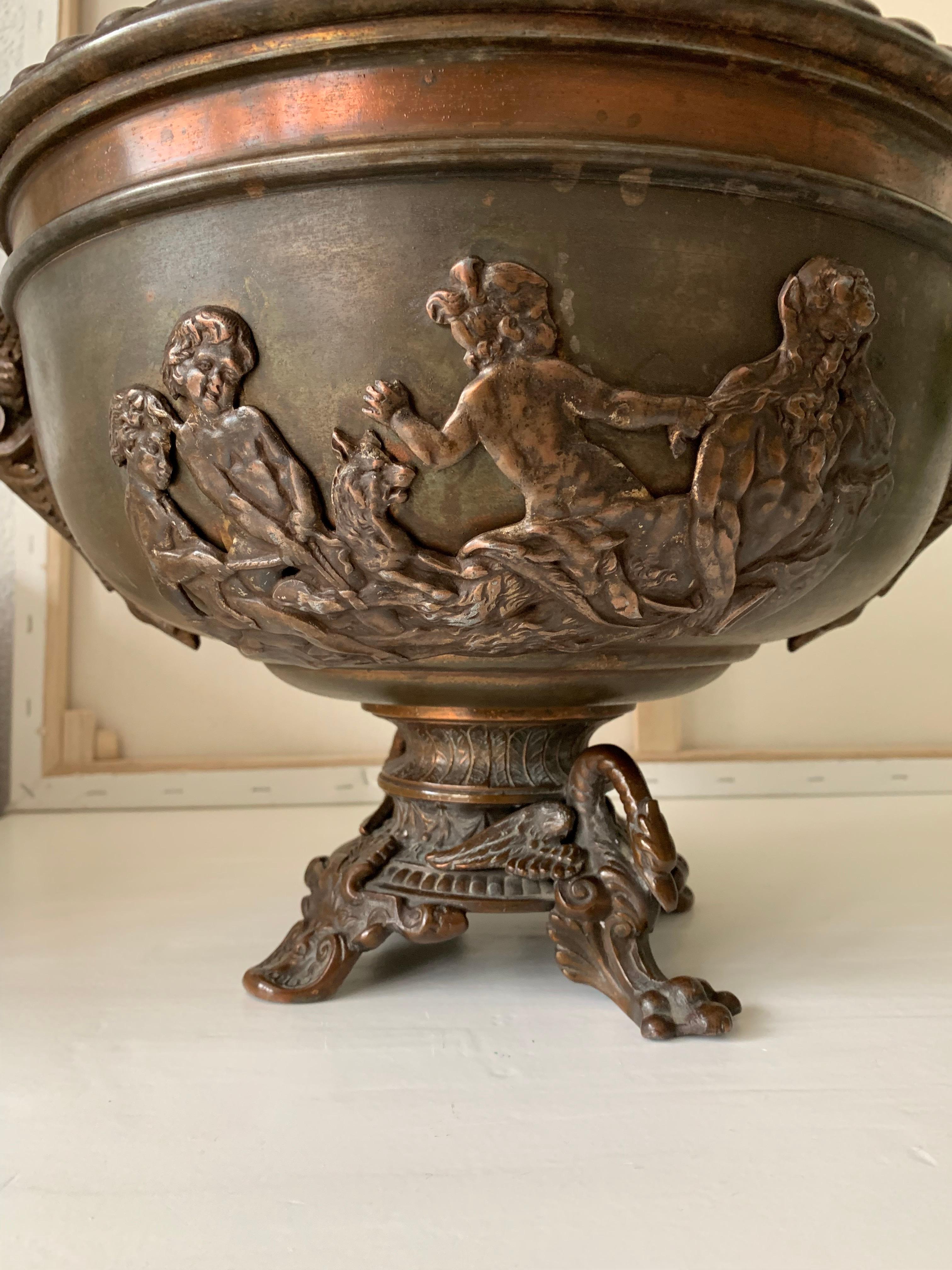 Decorative ash or coal bucket with fauns, putti and various mythological creatures.

If you are a collector of rare and sculptural antiques then this possibly unique bucket could be gracing your fireplace soon. The artisan metal worker who