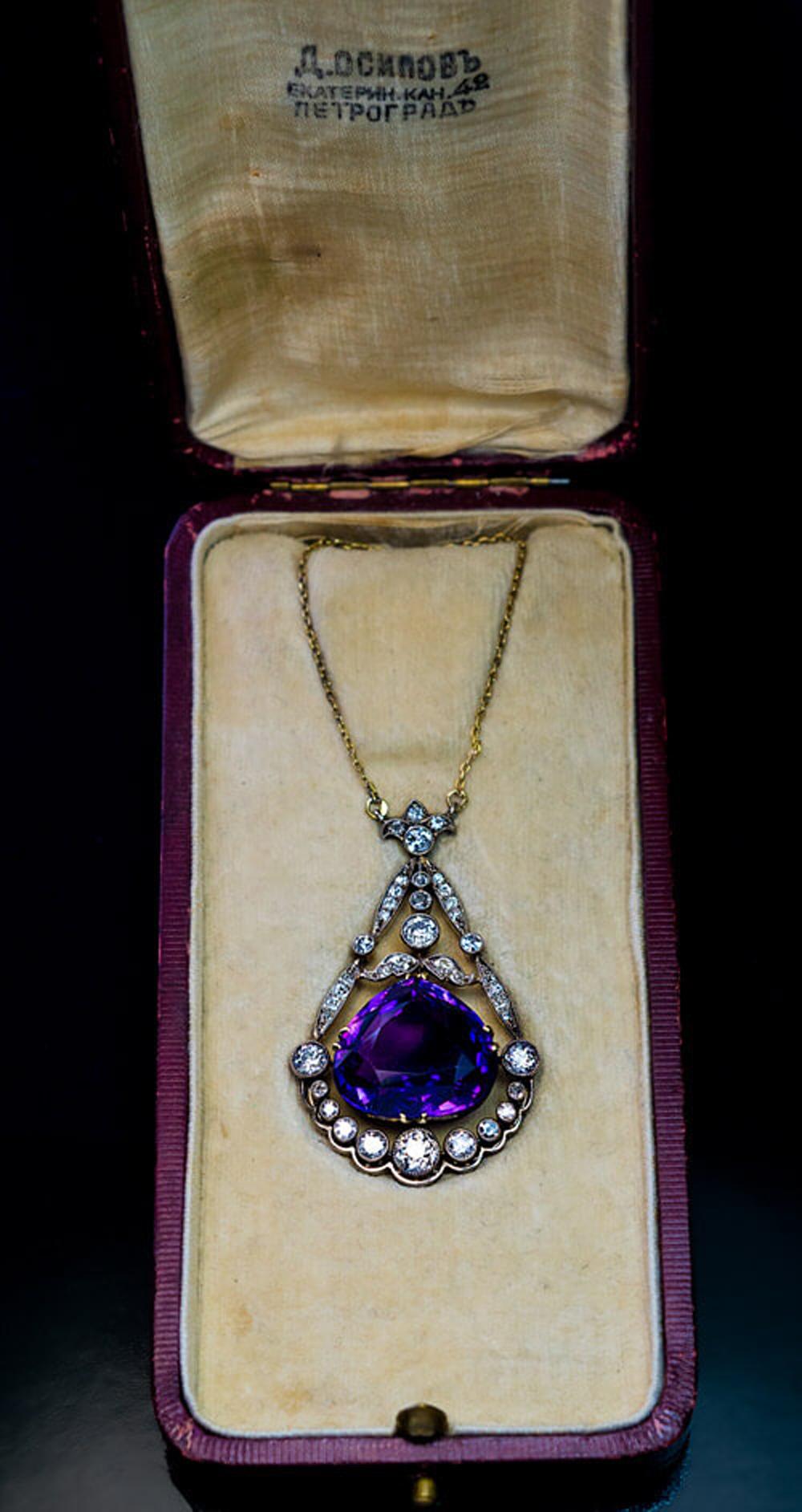 Saint Petersburg, Russia, circa 1915

The necklace is handcrafted in silver topped 14K gold (front – silver, back – gold). It features a pear shaped Siberian amethyst of a superb deep royal purple color. The amethyst is framed by bright white (G